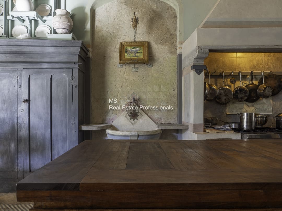 Rustic kitchen interior with wooden table and vintage decor.