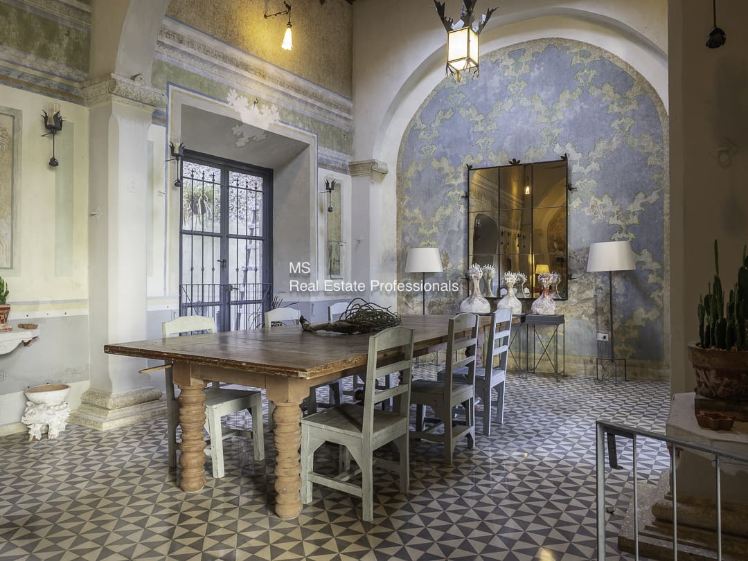 Rustic dining room with wooden table and vintage decor.