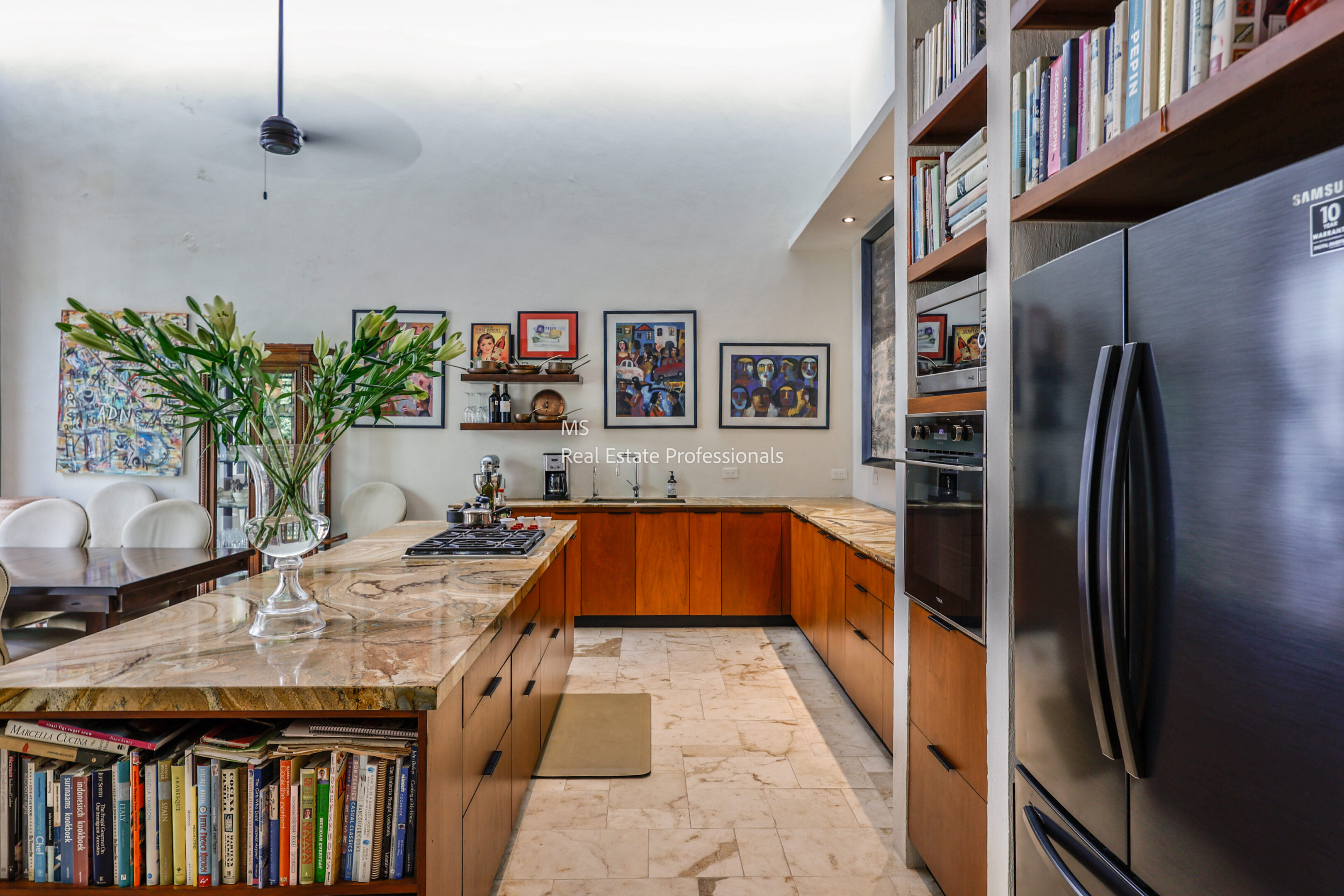 Modern kitchen with wooden cabinets and stainless steel appliances.