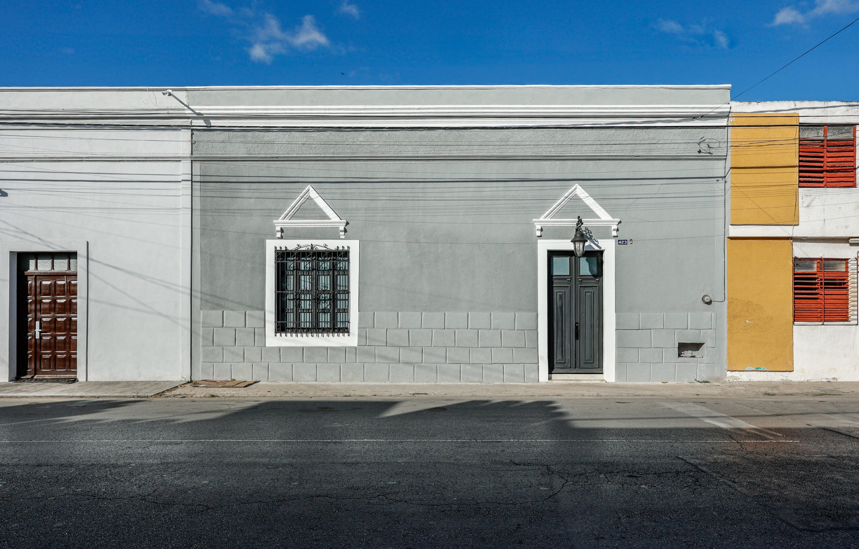 A building with two windows and a door.