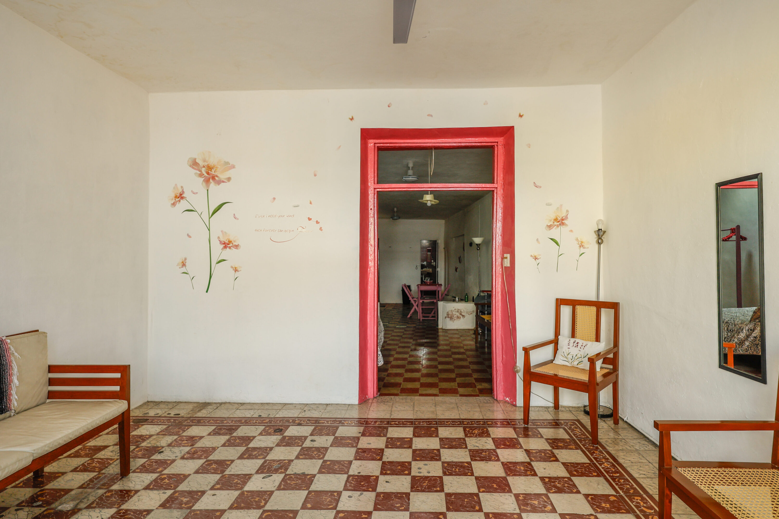 A room with a chair and a door.