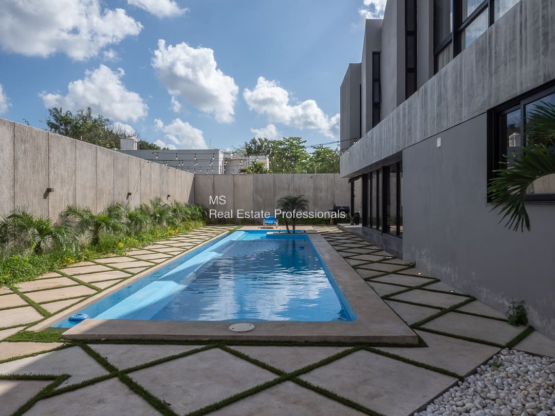 A pool in the middle of an outdoor area.