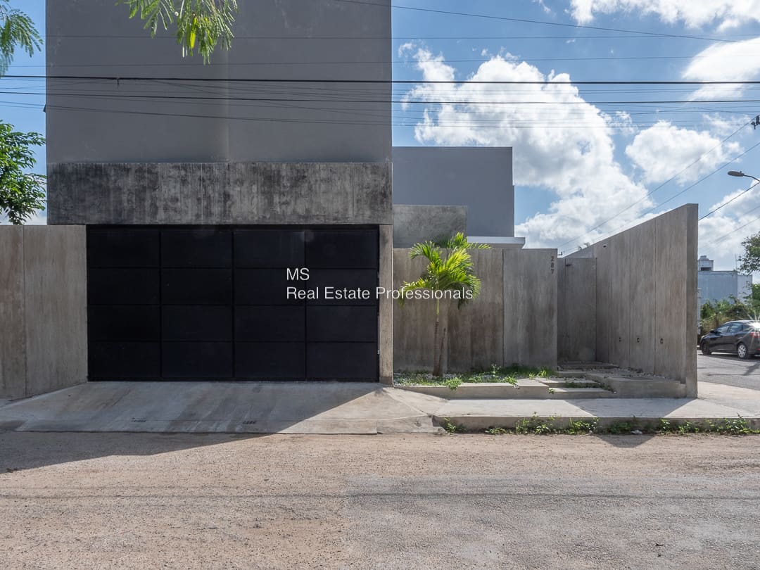 A building with a large black sign on the side of it.