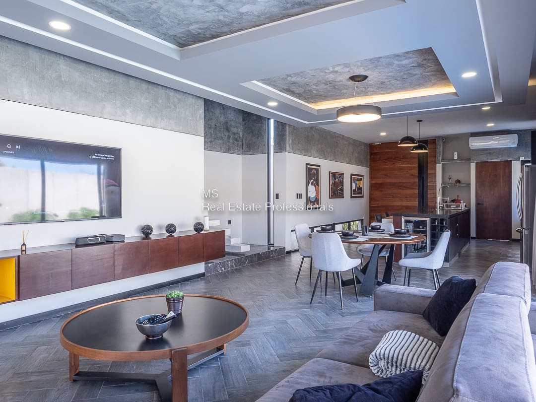 A living room with couches and tables in it
