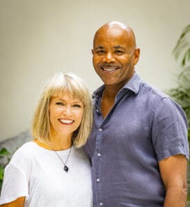 A man and woman standing next to each other.