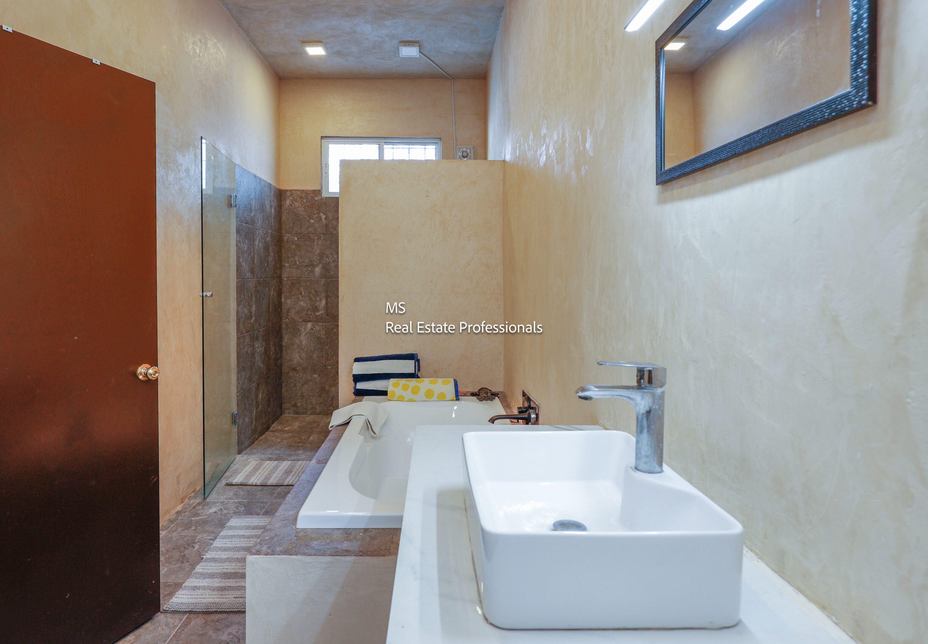 Modern bathroom with bathtub and sink.