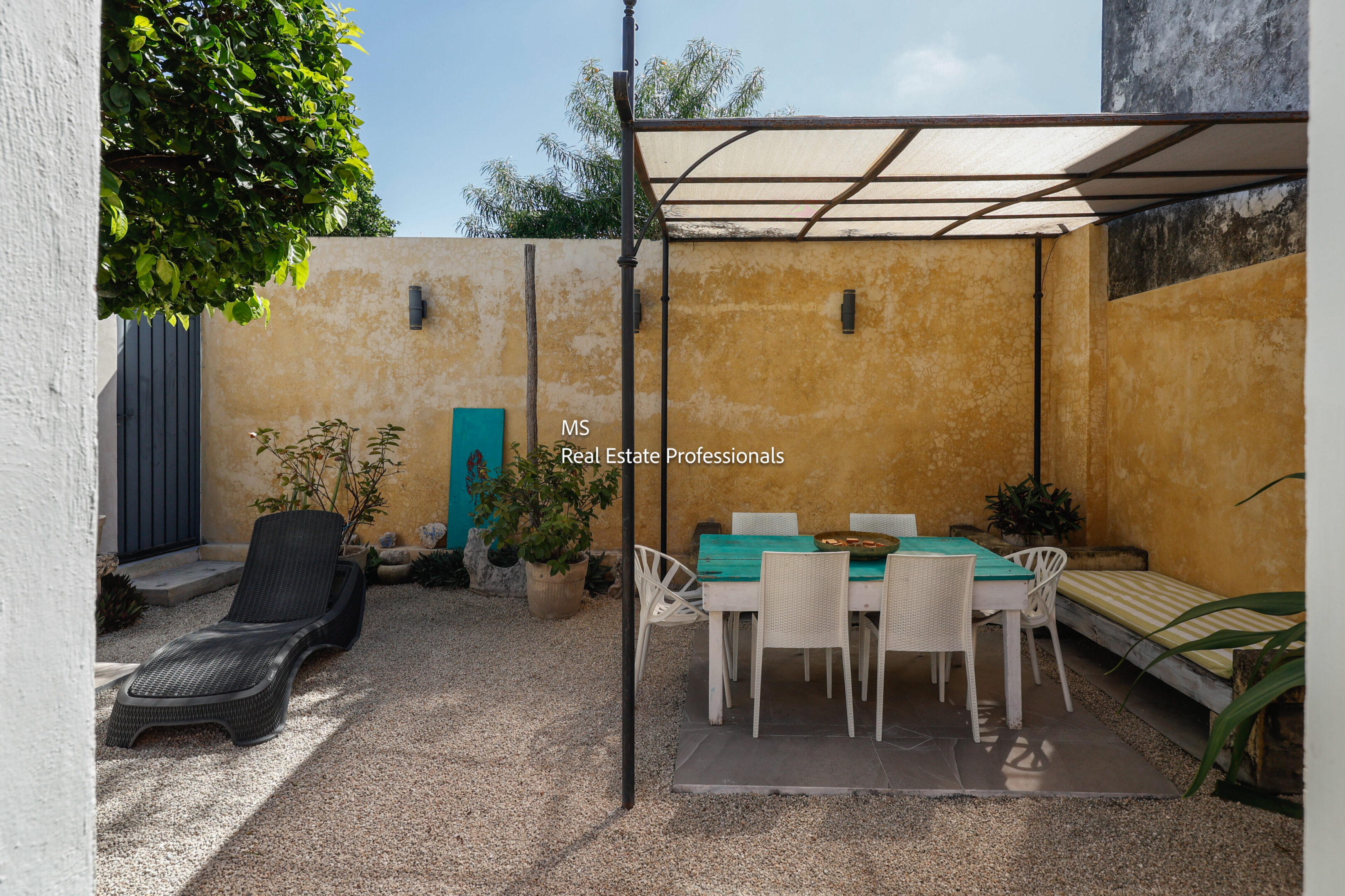 Mediterranean courtyard patio with table.