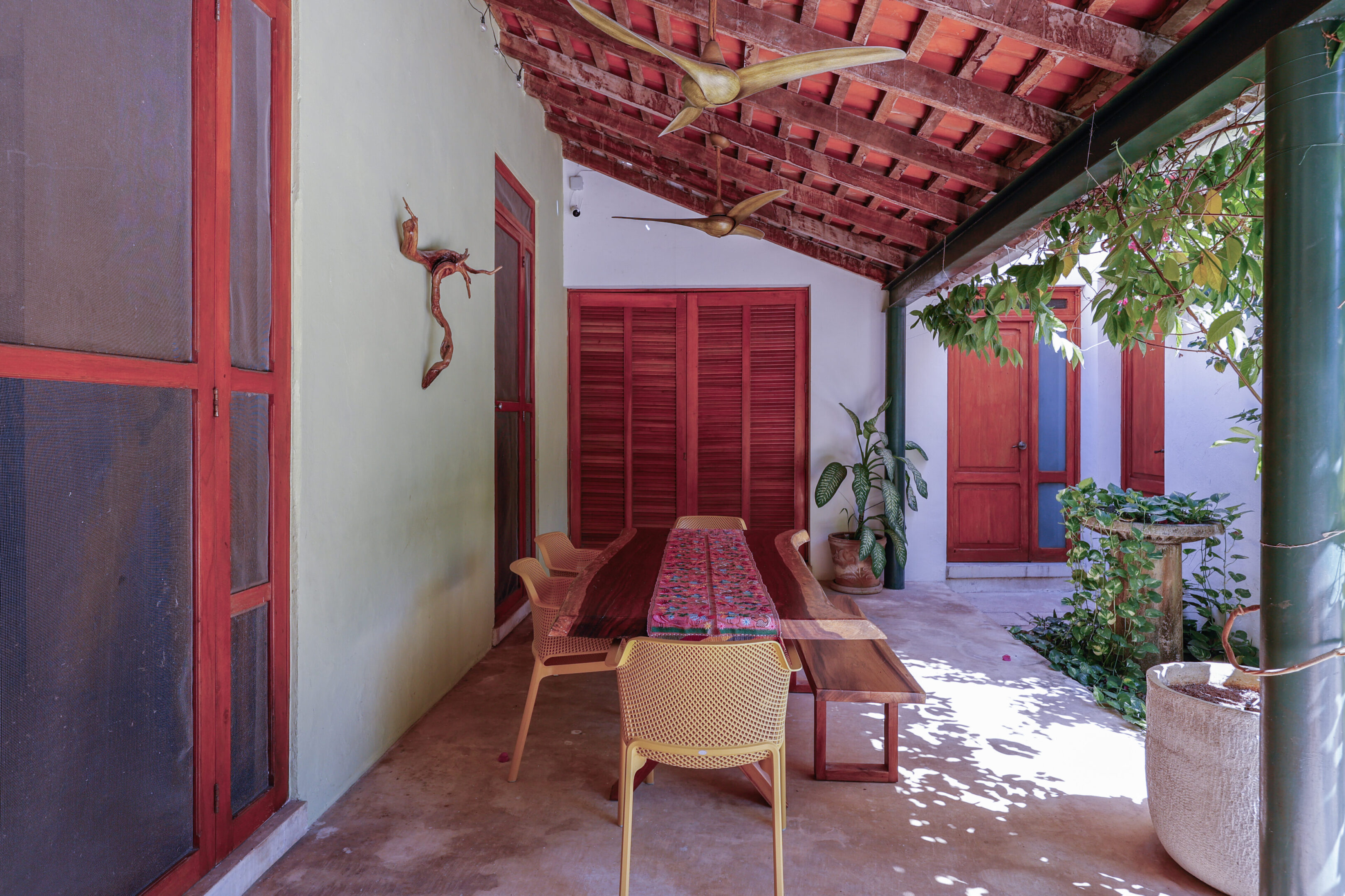 Outdoor patio with dining table and chairs.