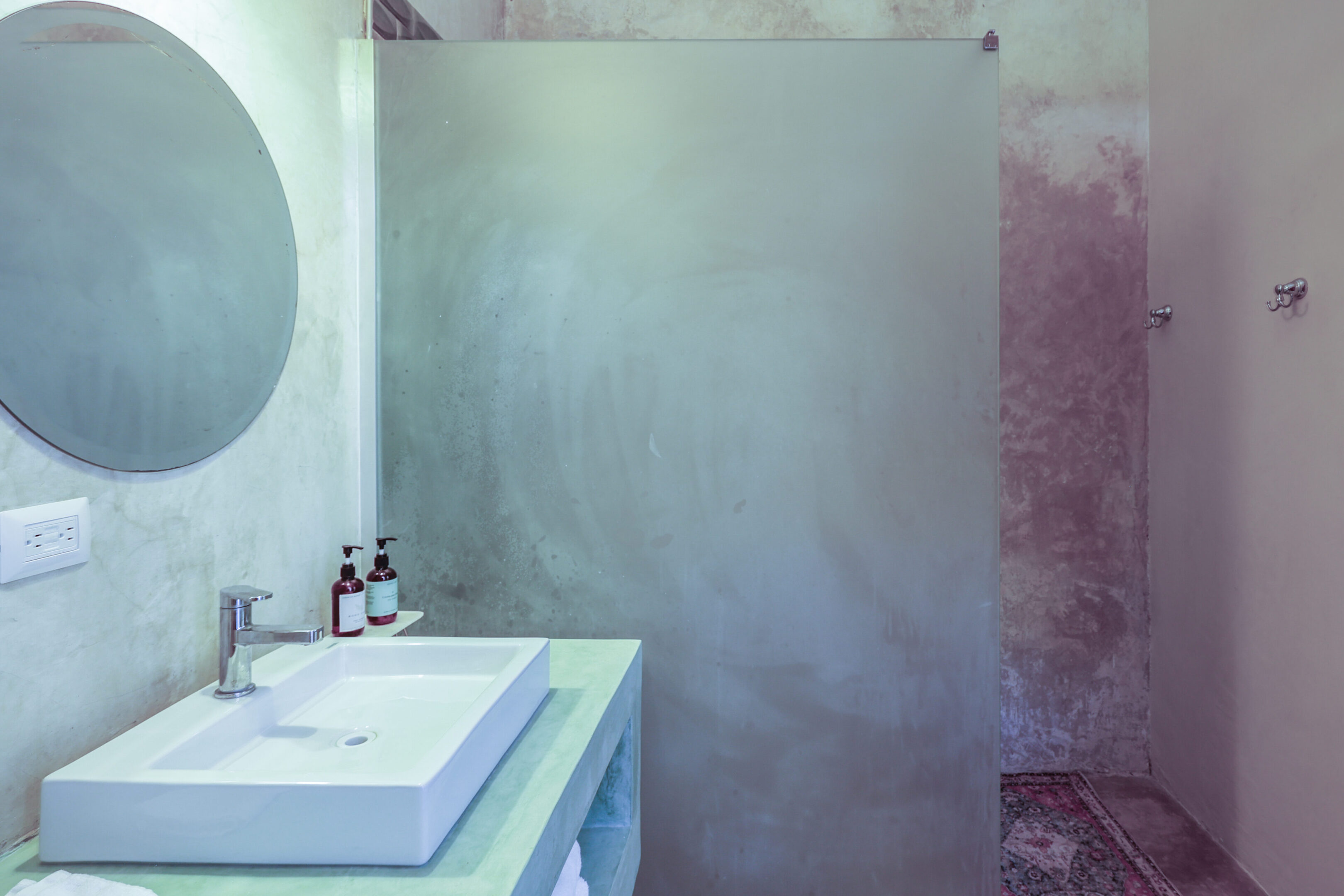 Modern bathroom with frosted glass shower.