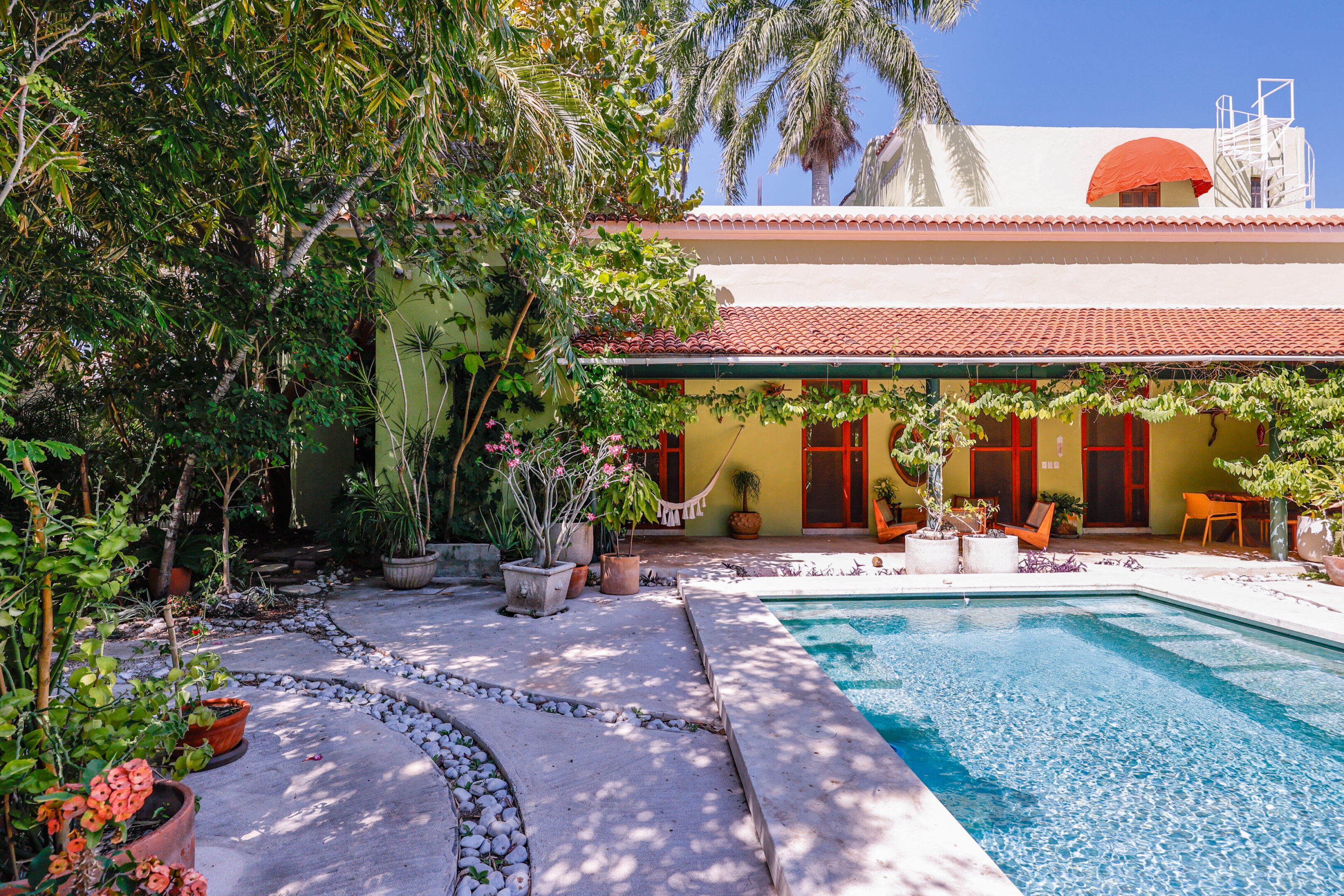 Tropical house with pool and garden.