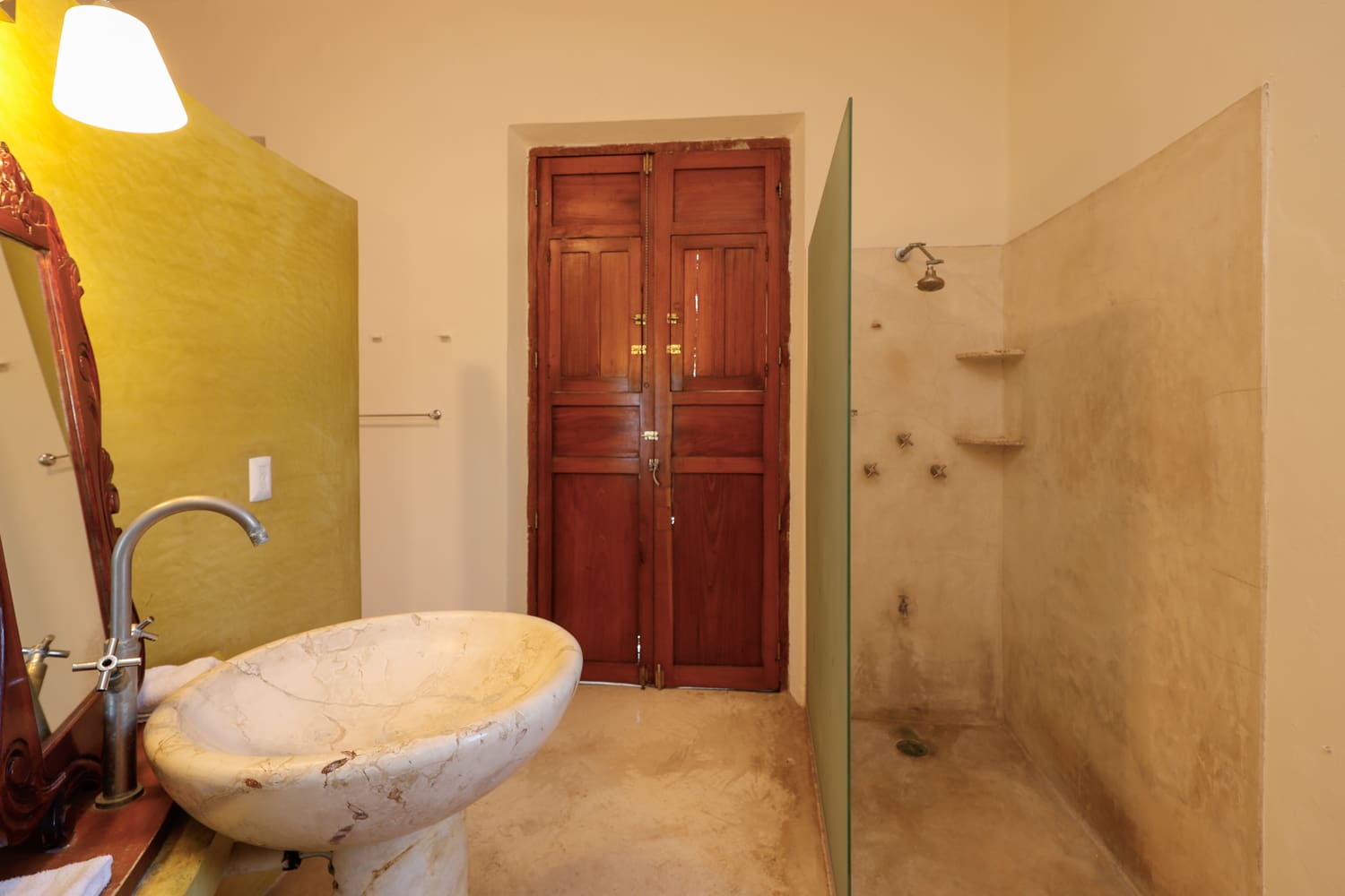 Elegant bathroom with marble sink and shower.