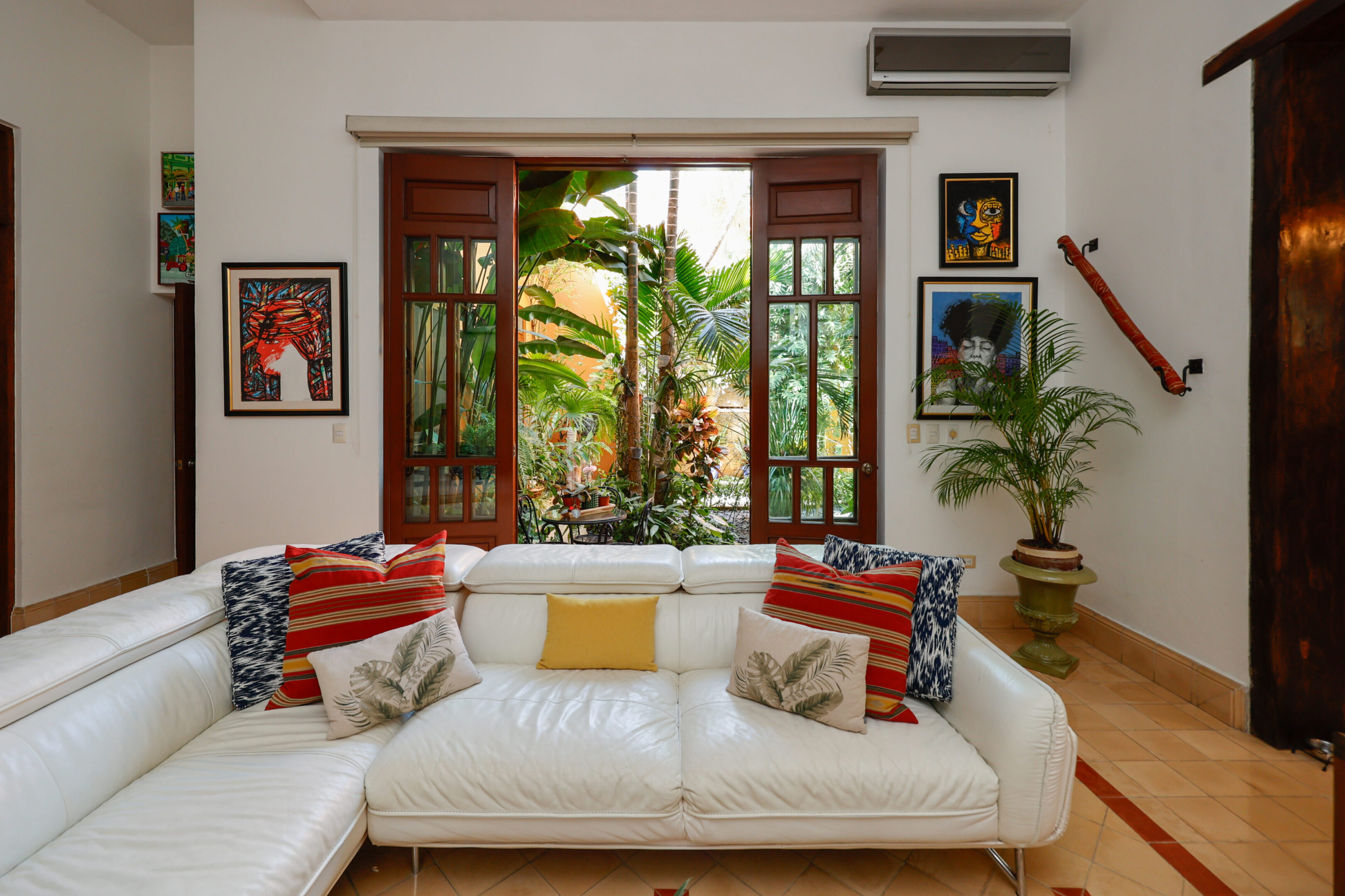 White couch in a tropical living room.