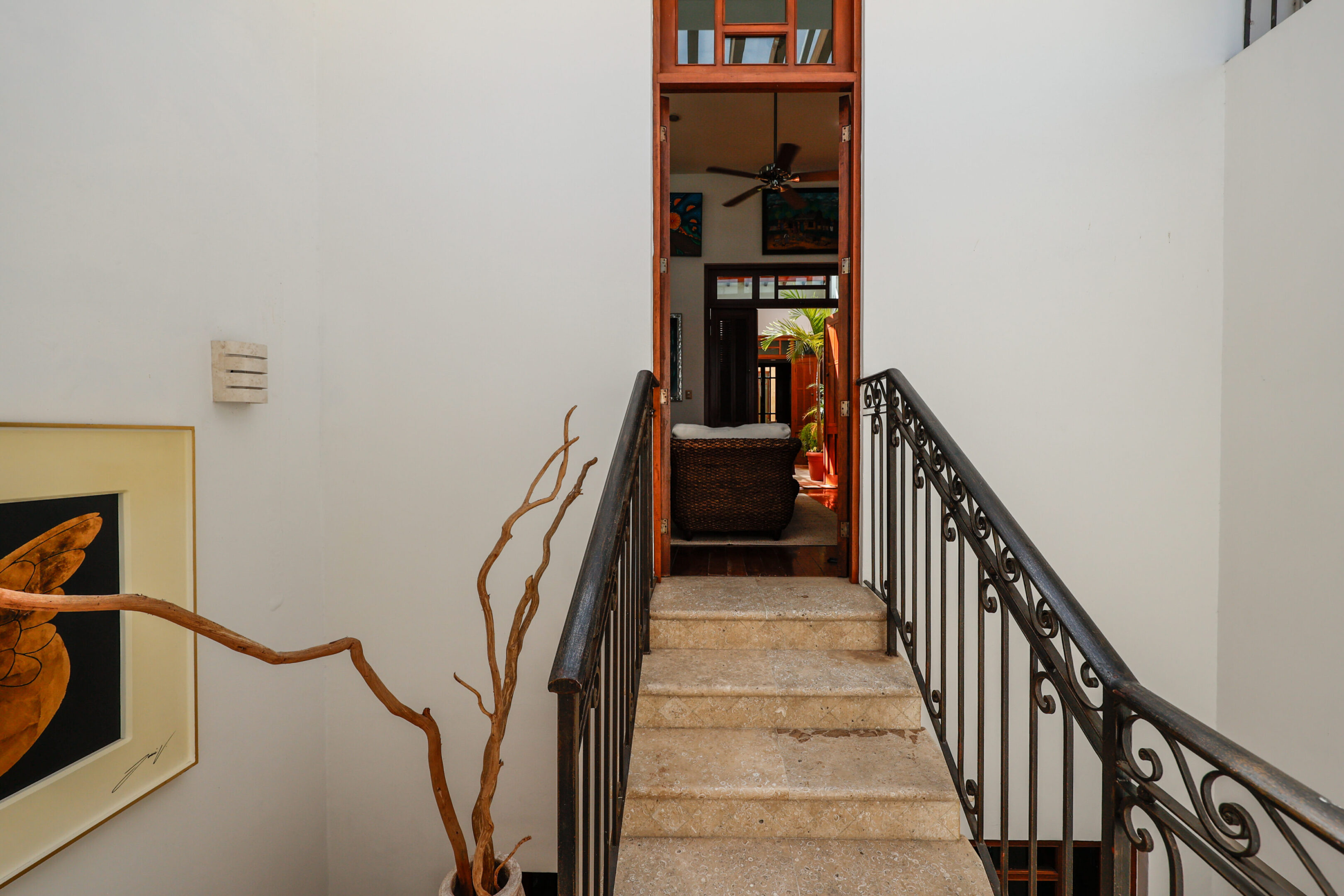 Indoor staircase leading to a living room.