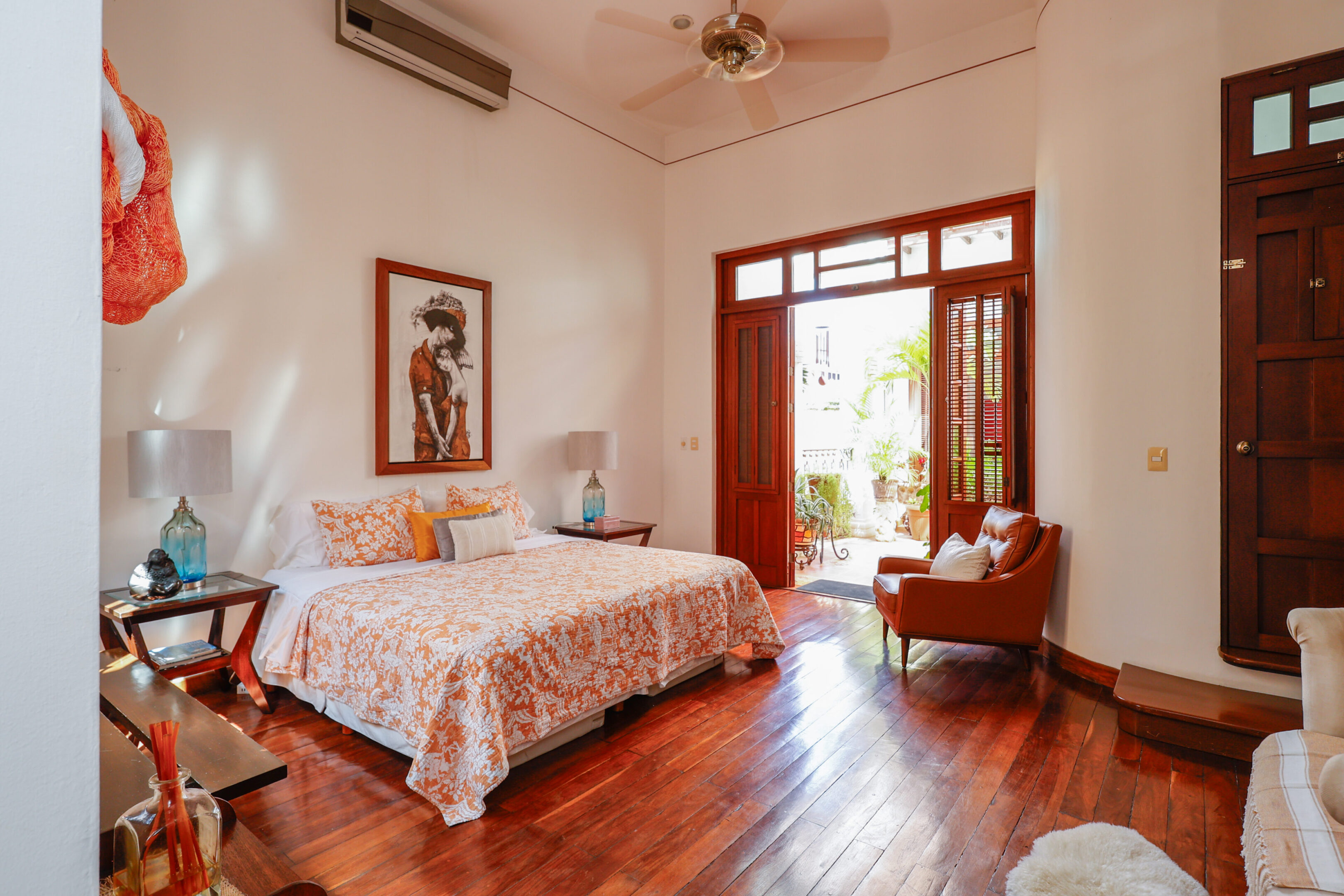 Orange bedroom with patio access.