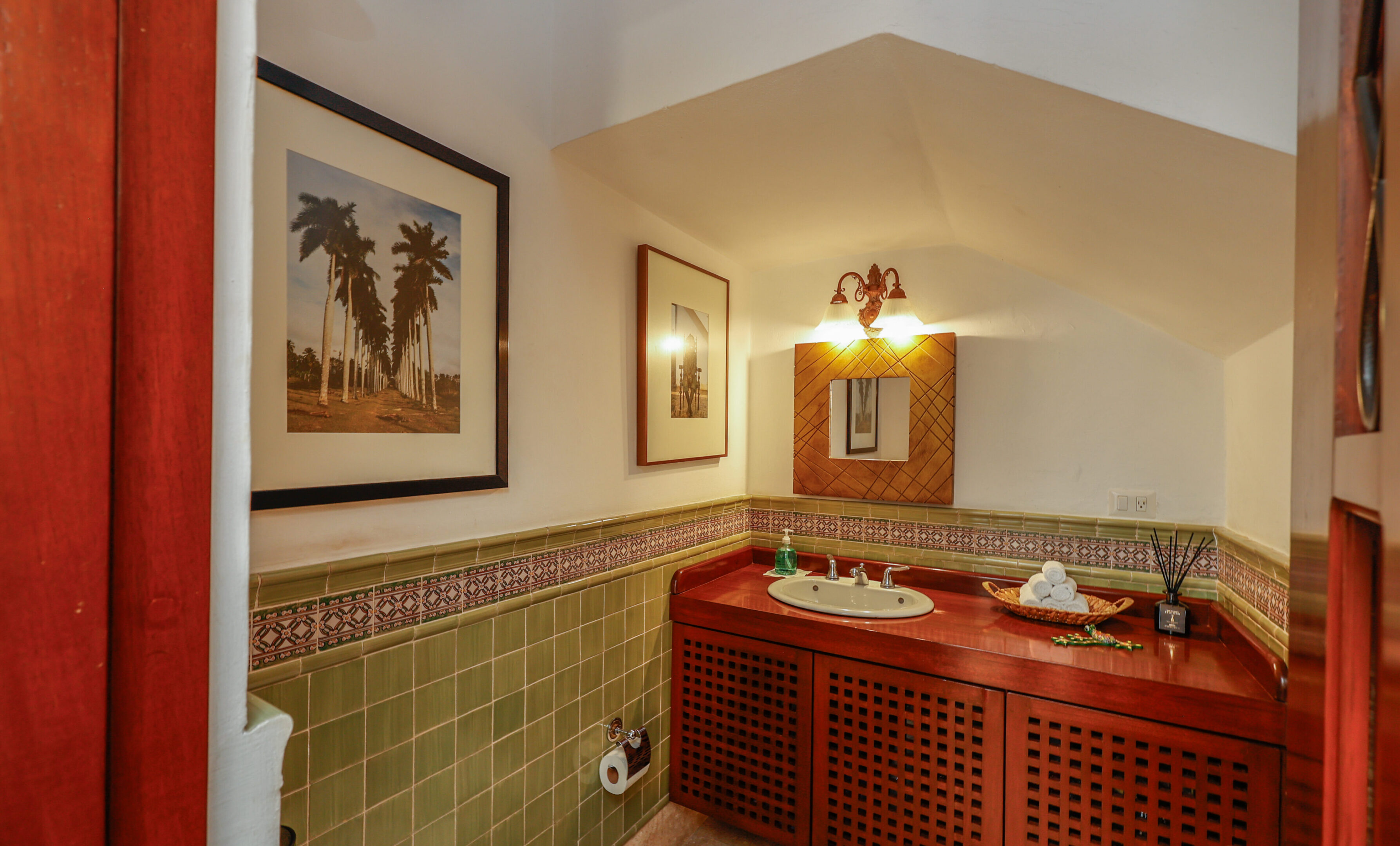 Upscale bathroom with palm tree art.