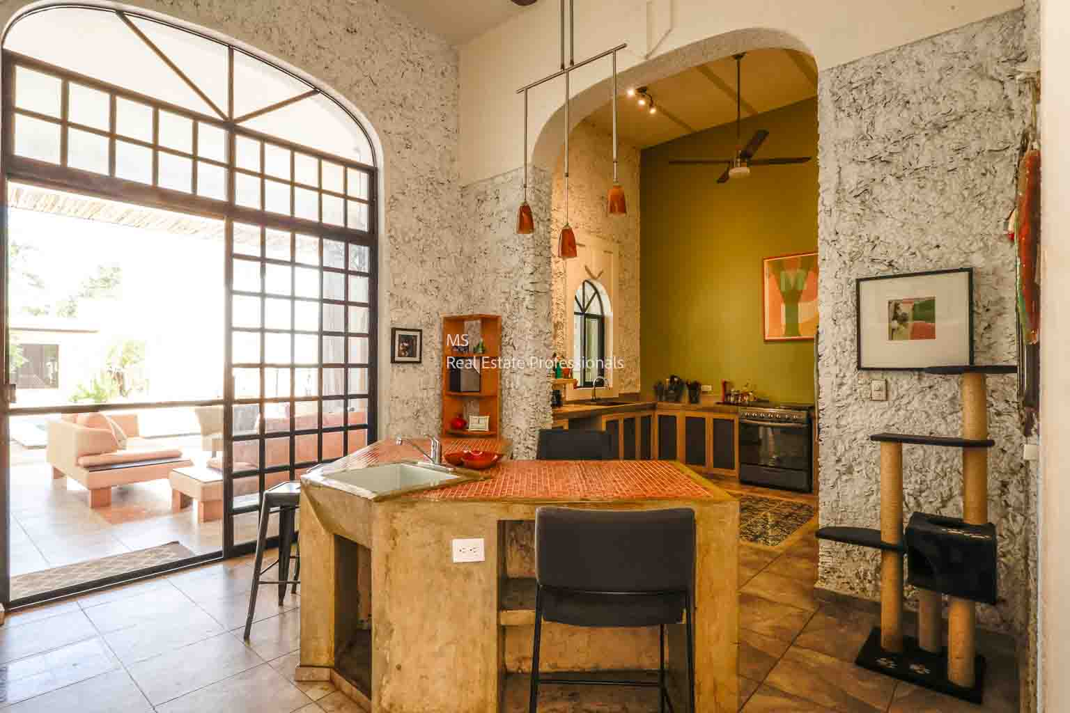 Cozy rustic cafe interior with stone walls and wooden furniture.