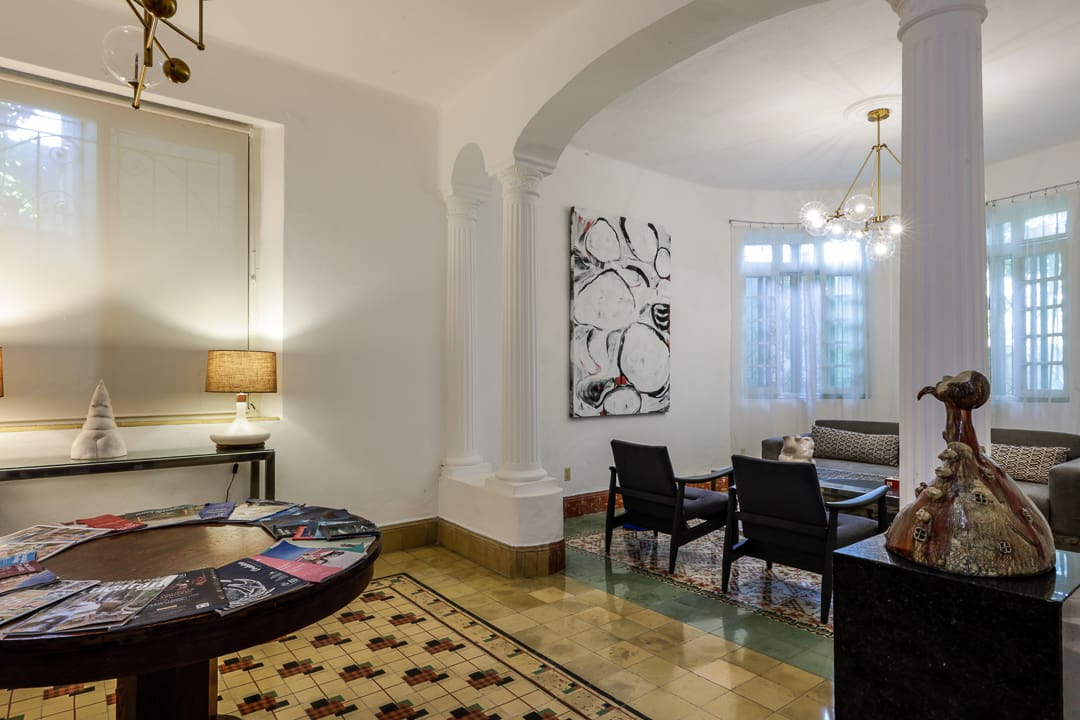 Elegant dining room with modern art and classic decor.