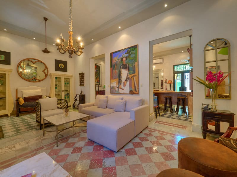 Elegant living room with classic chandelier and plush seating.