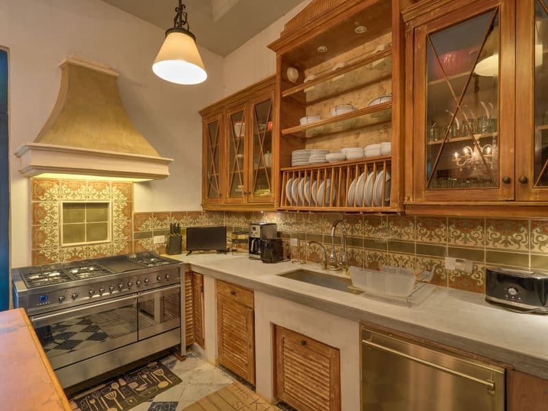 Cozy kitchen with wooden cabinets and a vintage stove.