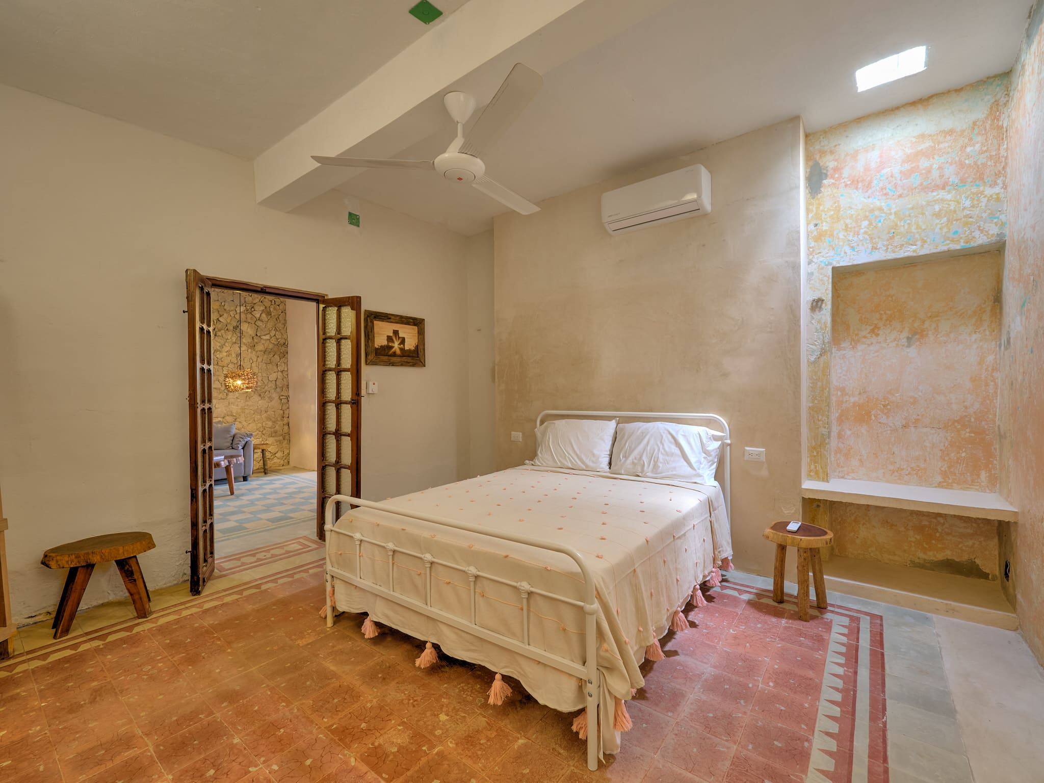 Cozy bedroom with a vintage wooden bed and rustic decor.