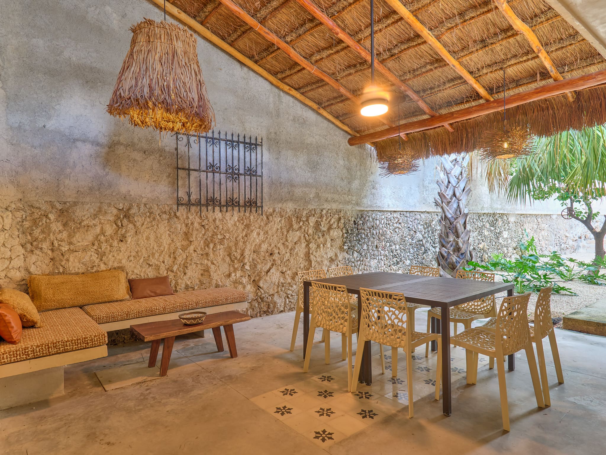Cozy indoor space with rustic stone walls and wooden furniture.