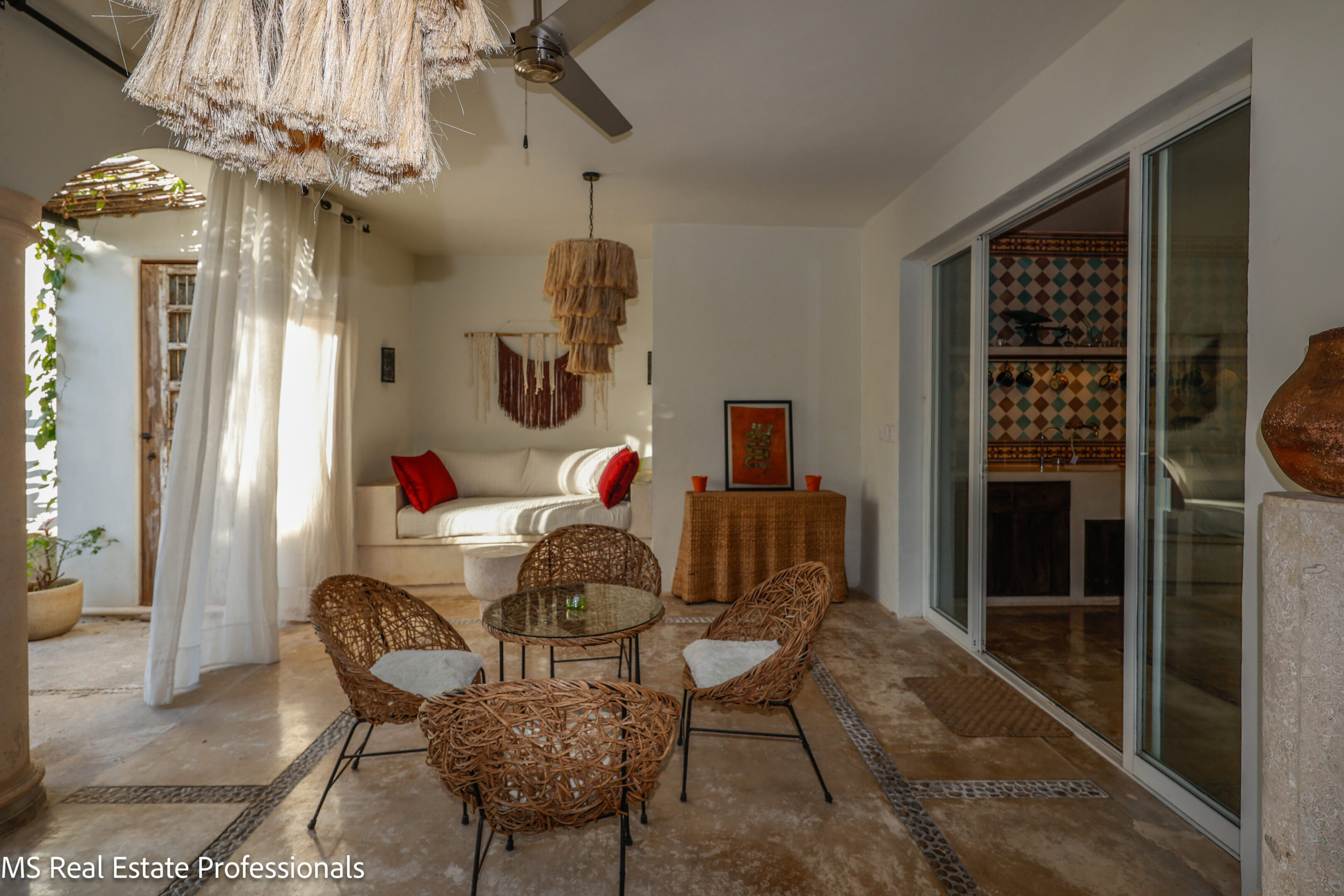 Cozy living room with wicker furniture and warm natural tones.