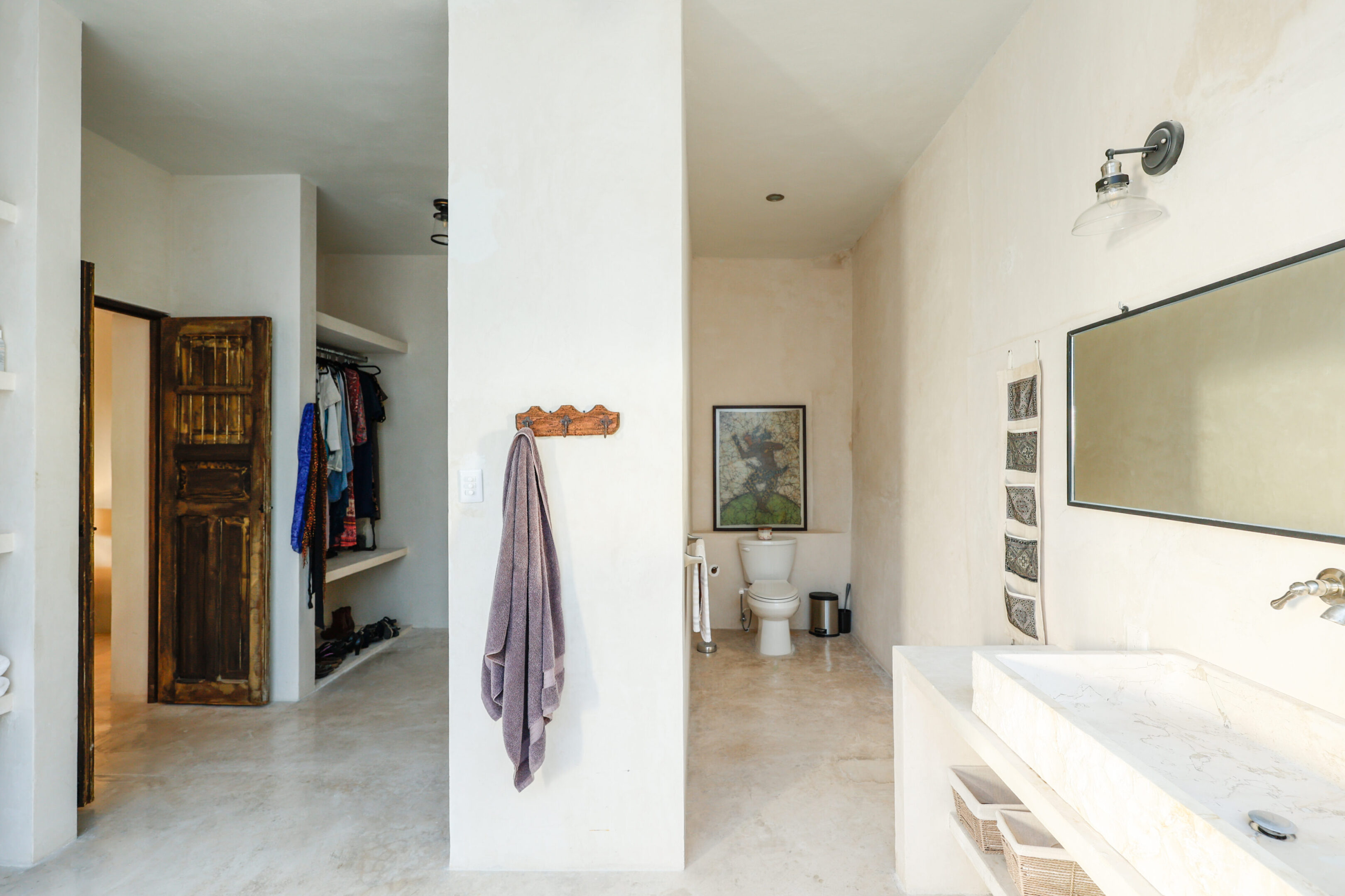 Minimalist bathroom with white walls and modern fixtures.