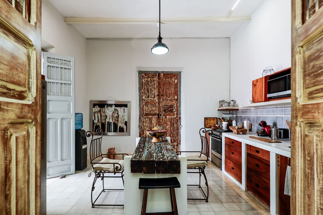 Rustic kitchen with vintage furniture and decor.