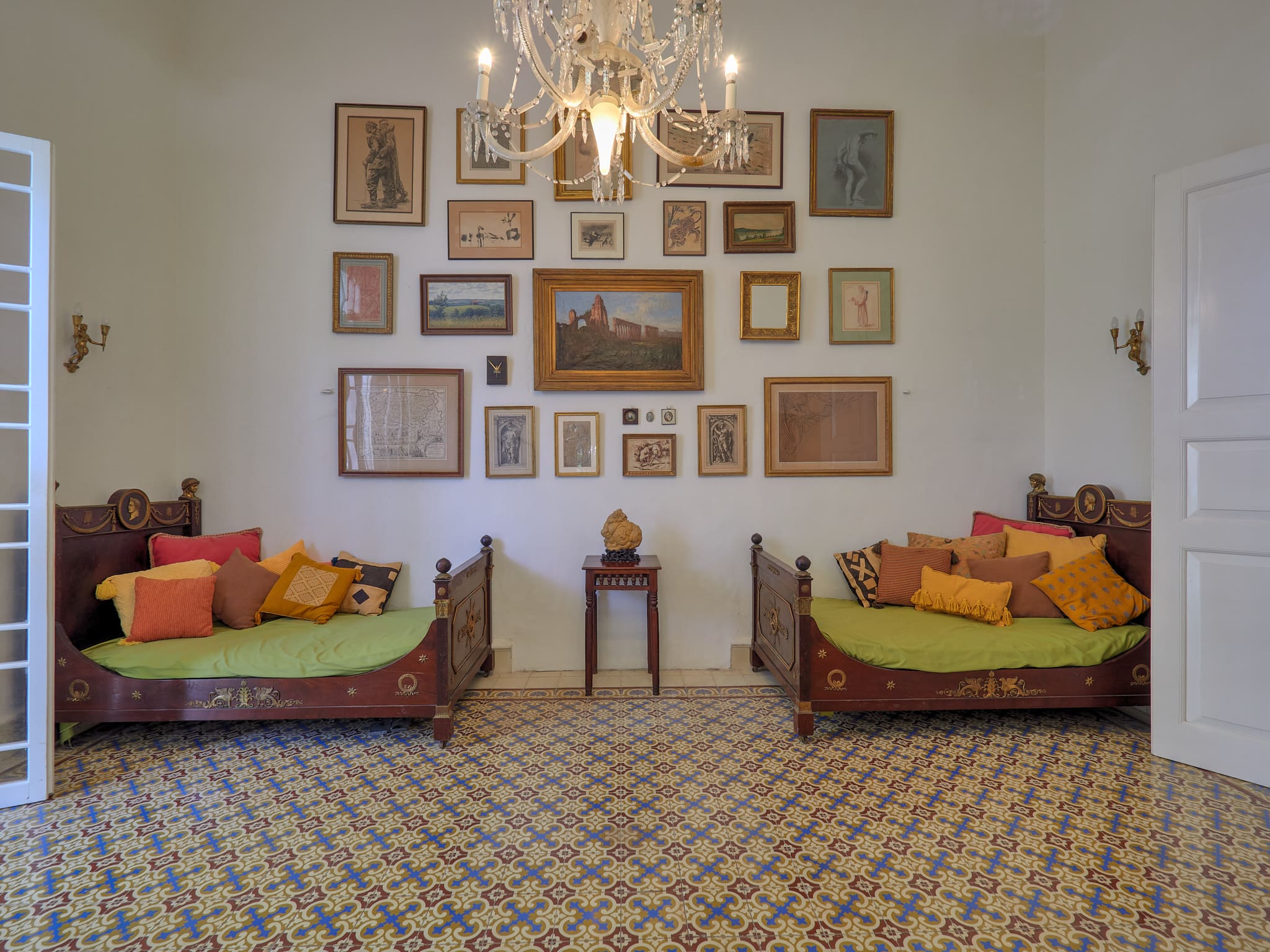 A cozy living room with two sofas and framed art on the wall.