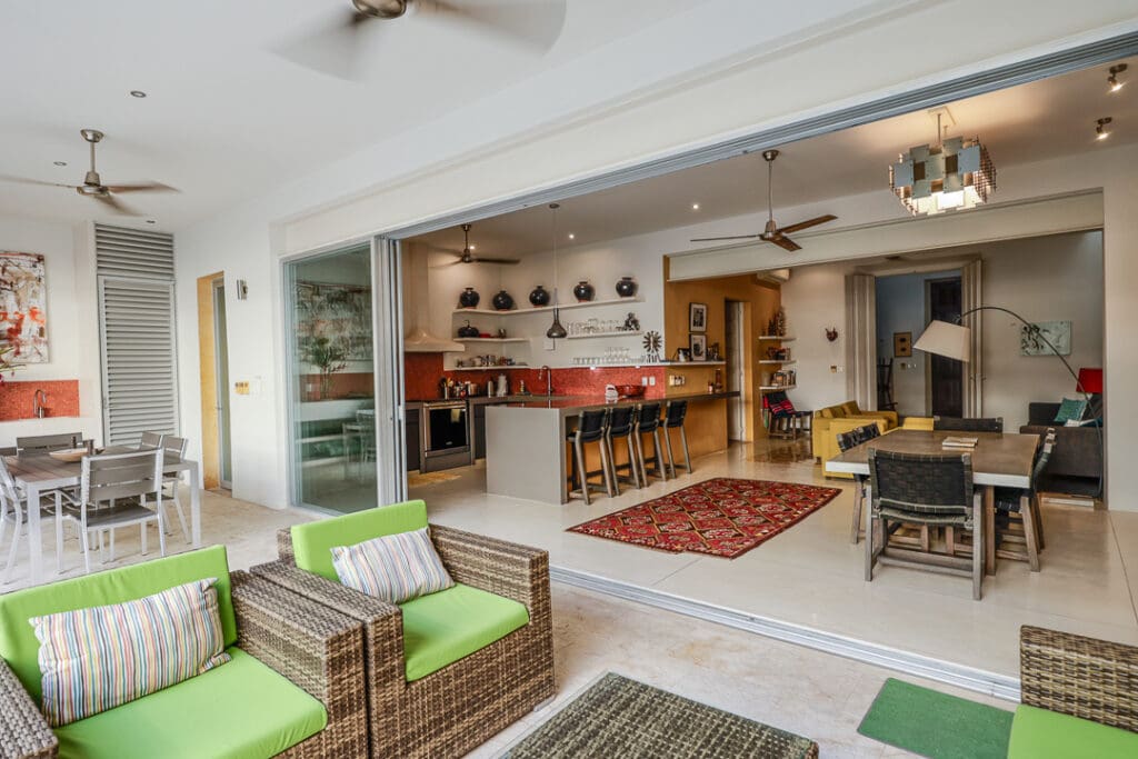 Open-concept living area blending indoor and outdoor spaces with natural decor.
