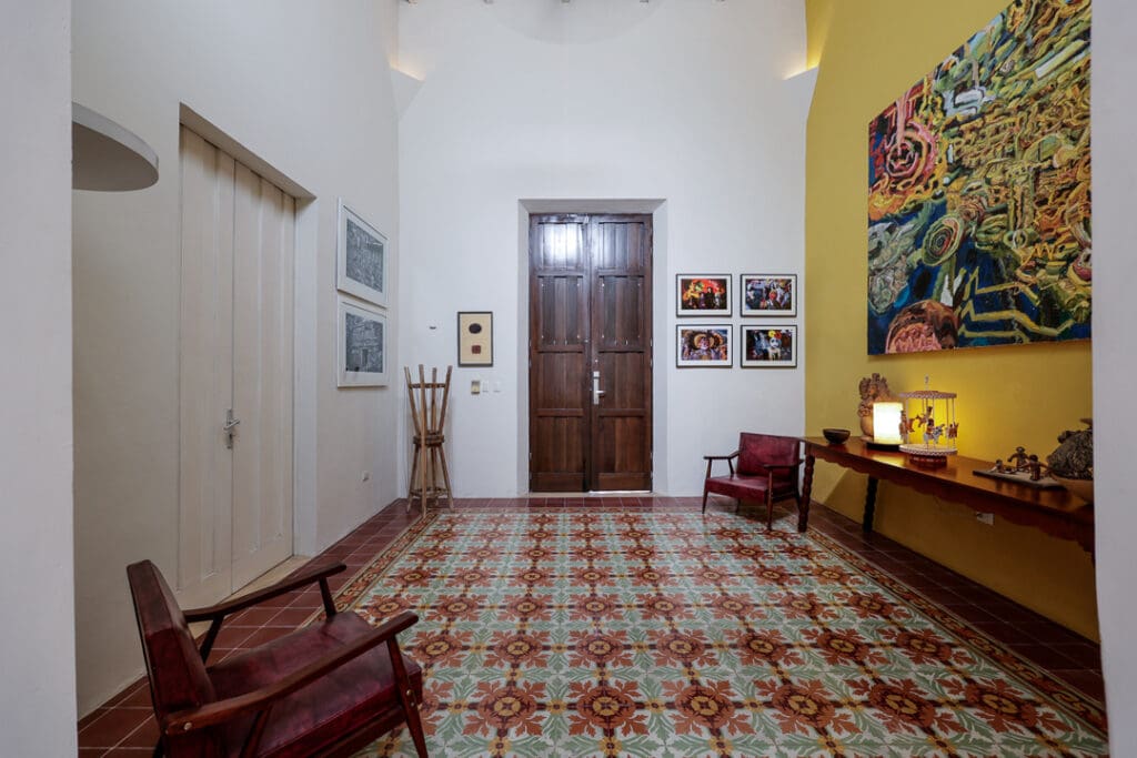 Cozy room with vintage furniture and patterned tile floor.