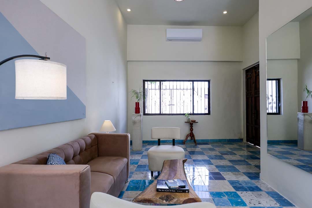Cozy living room with colorful tiled floor and modern decor.