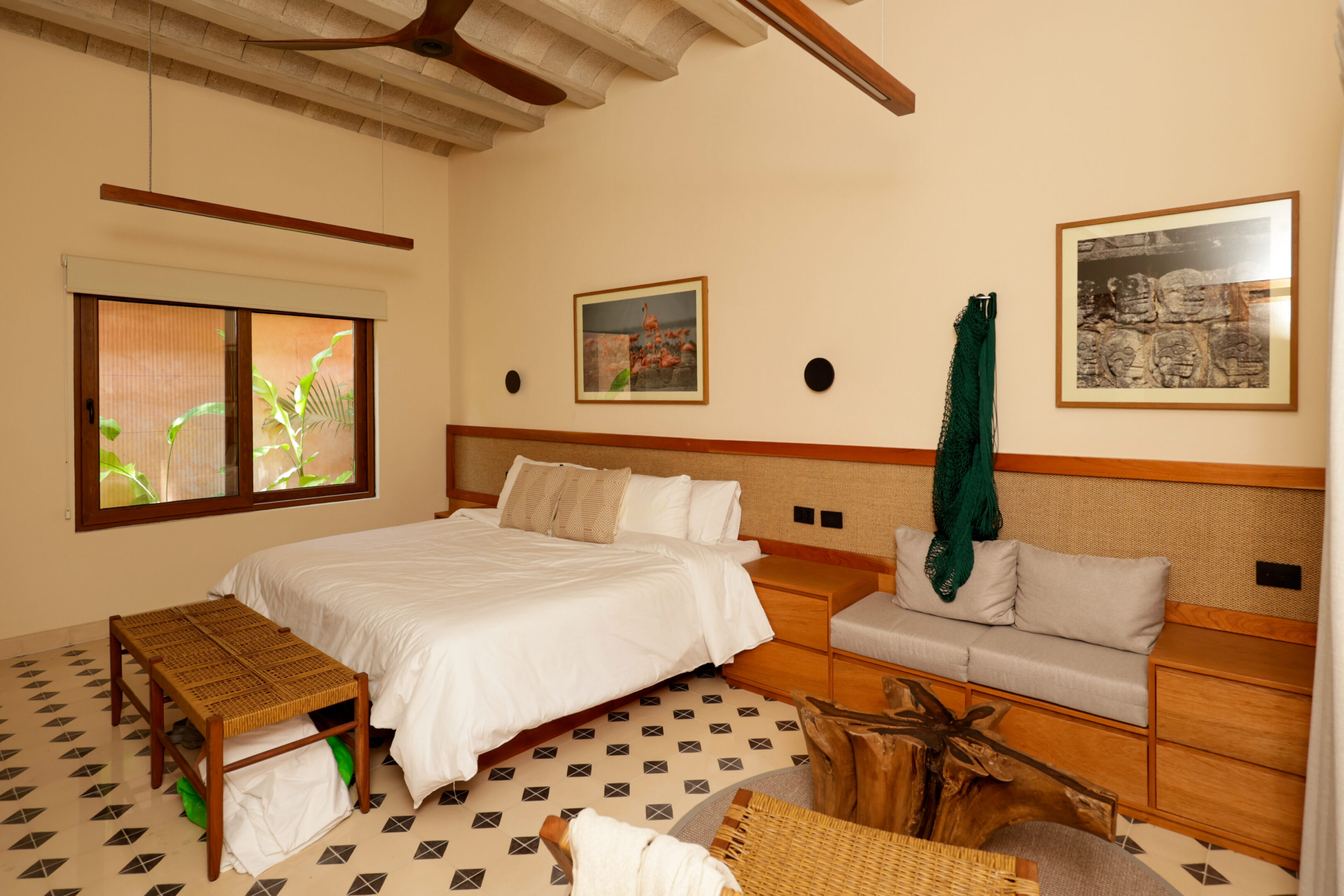 Cozy bedroom with wooden beams and classic decor.