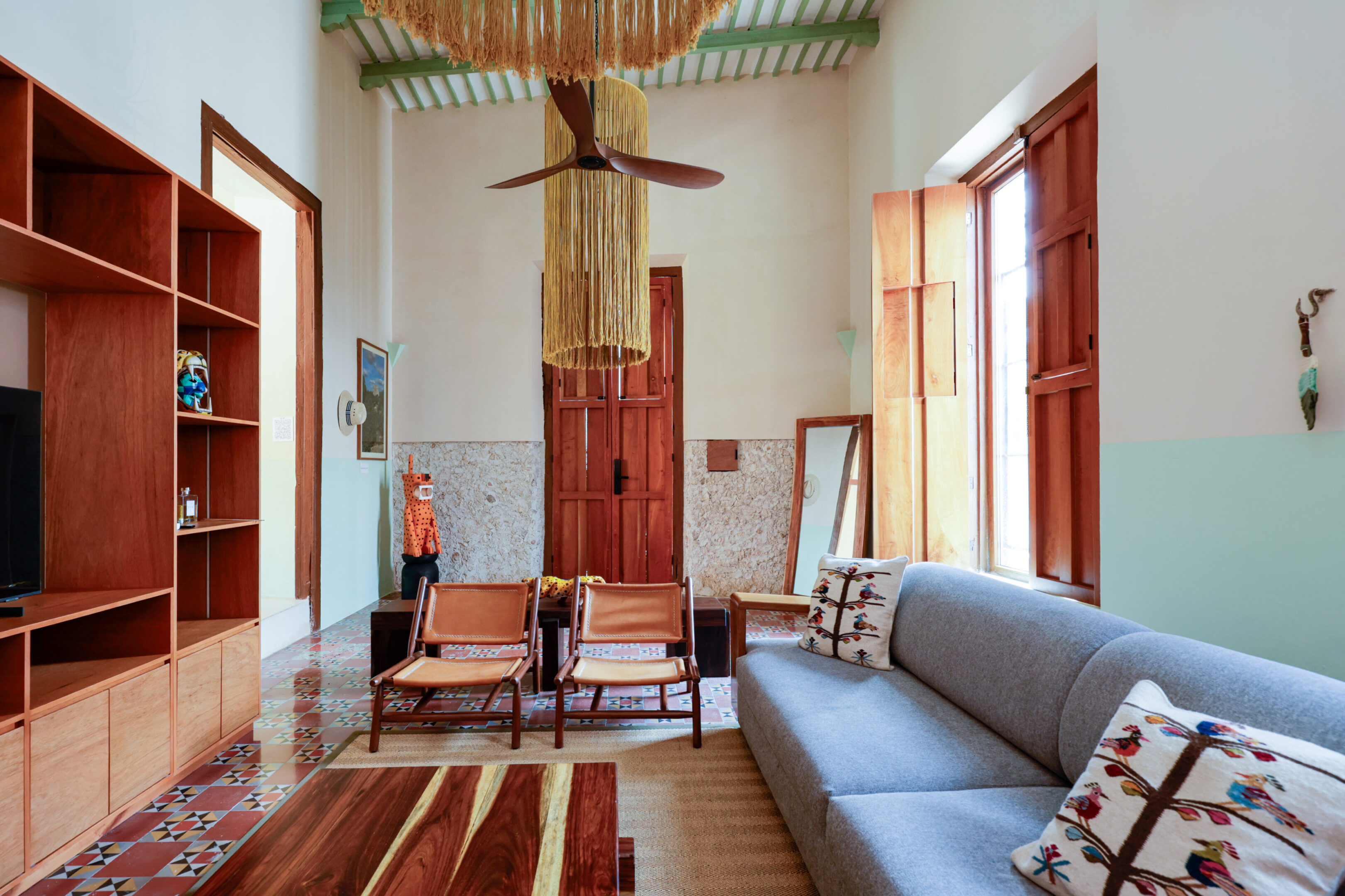 Cozy living room with a modern sofa and wooden accents.