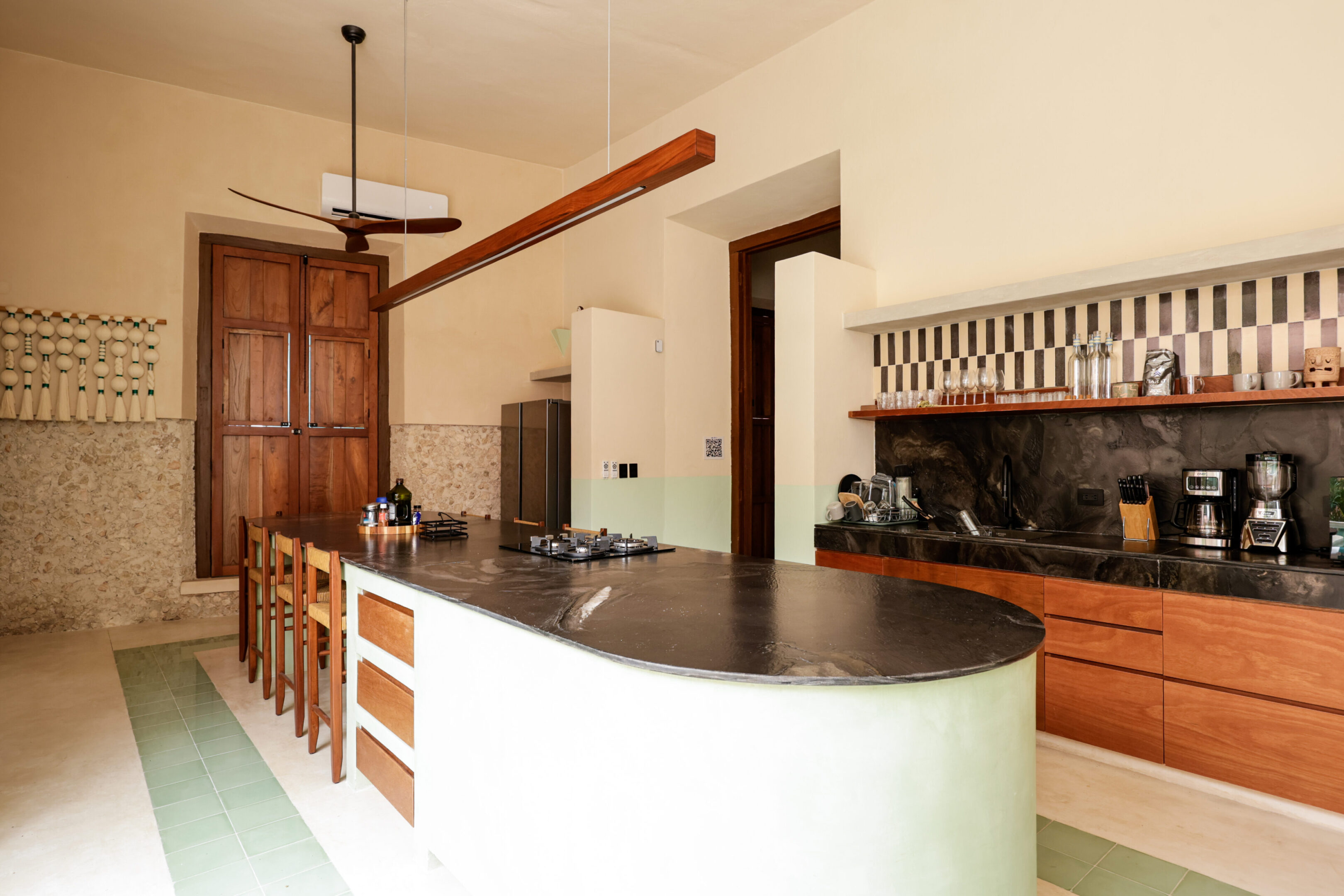 Spacious kitchen with a large island and wooden cabinetry.