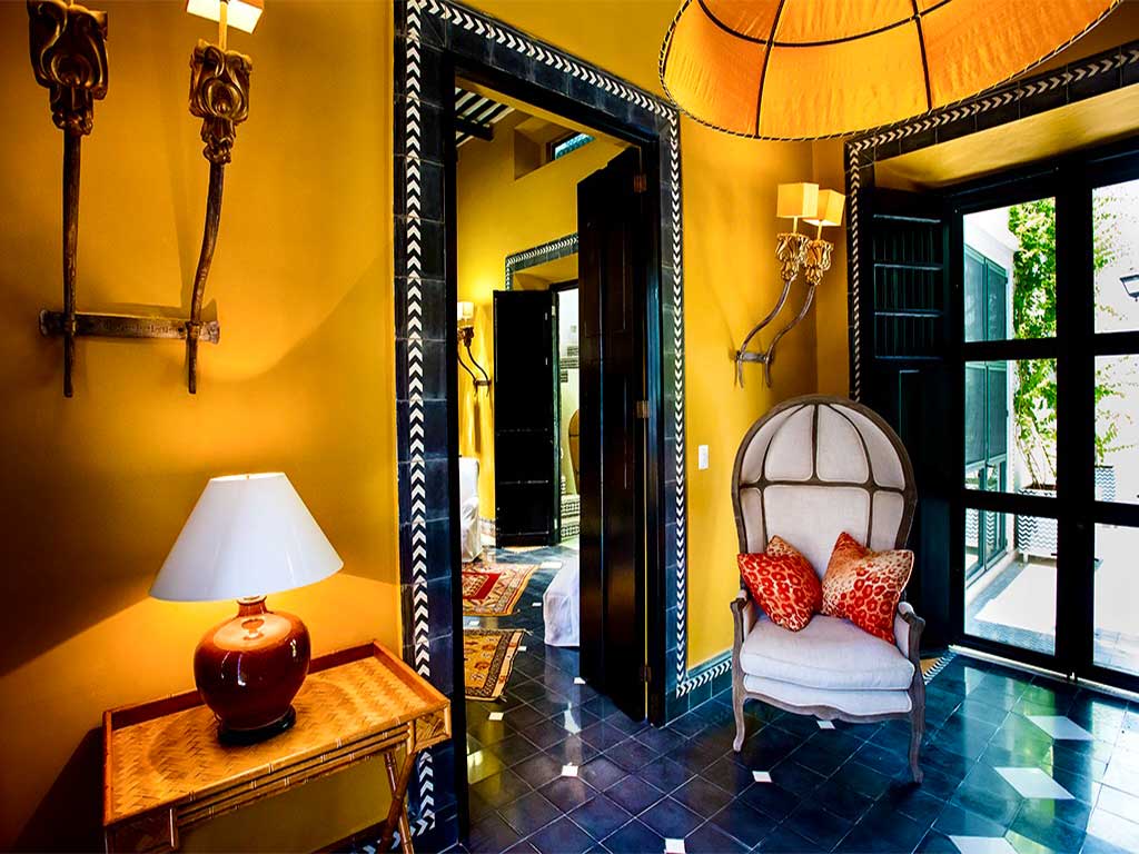 Yellow room with high-back chair and lamp