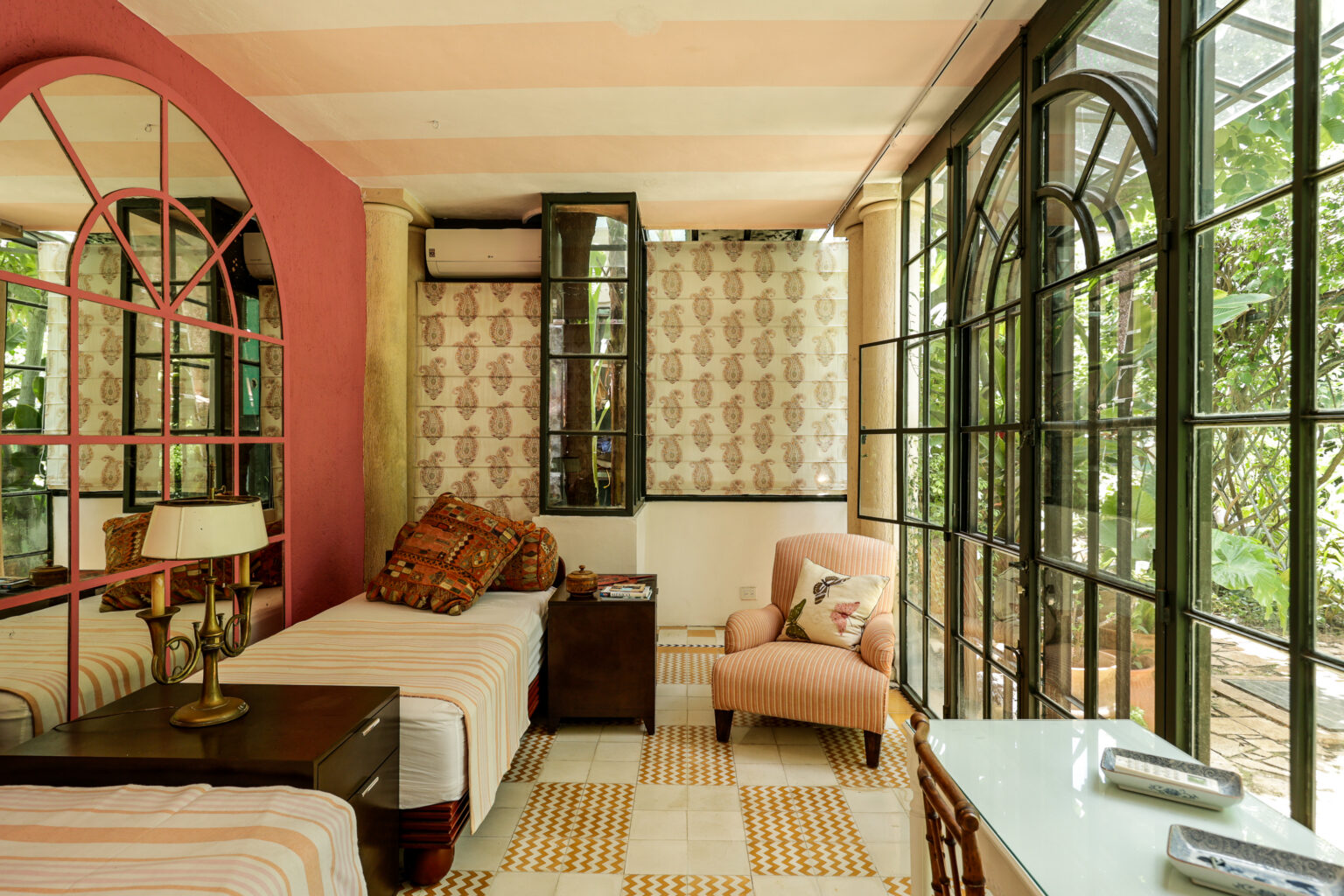 Cozy sunlit bedroom with arched glass windows