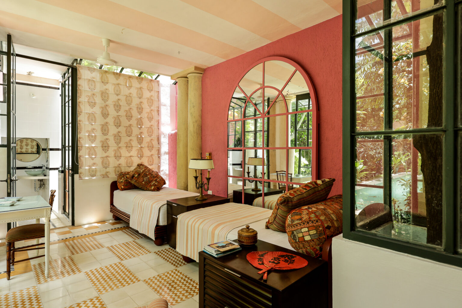 Bright twin bedroom with arched mirror