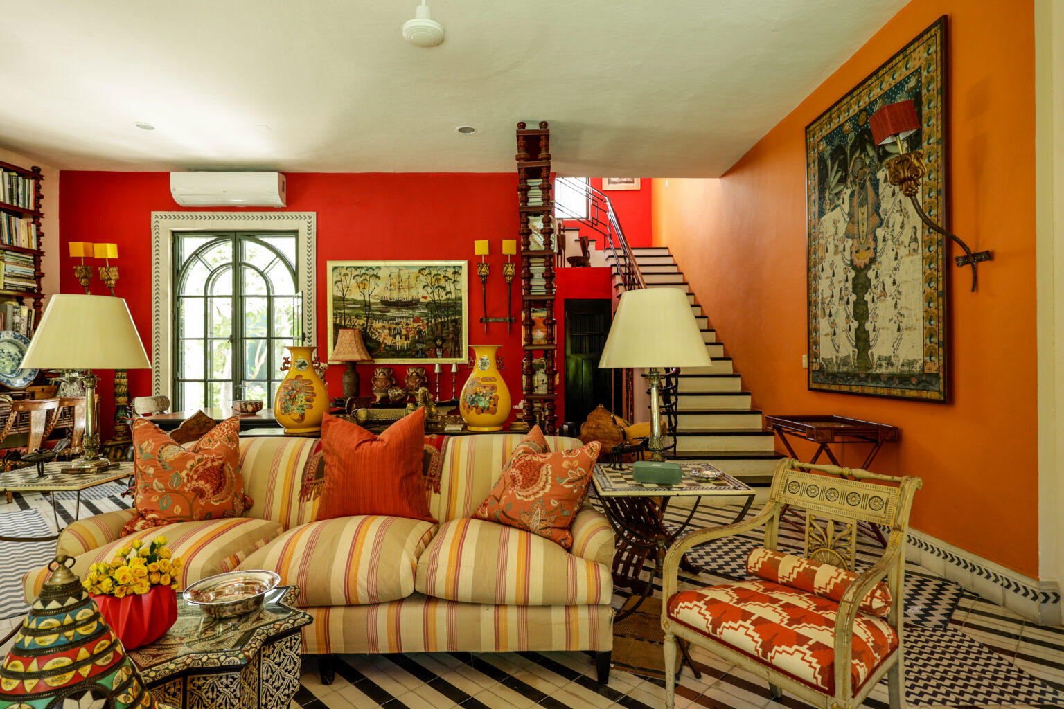 Vibrant eclectic living room with striped sofa