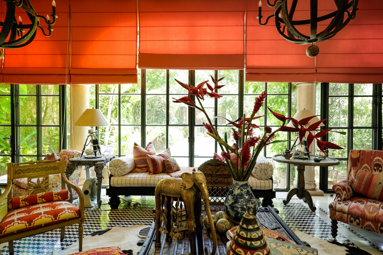 Eclectic living room with red shades and decor