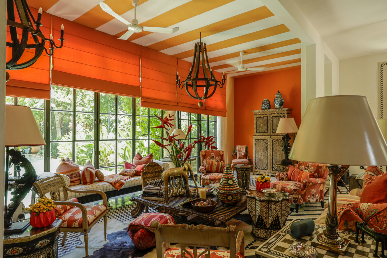 Vibrant eclectic living room with orange accents