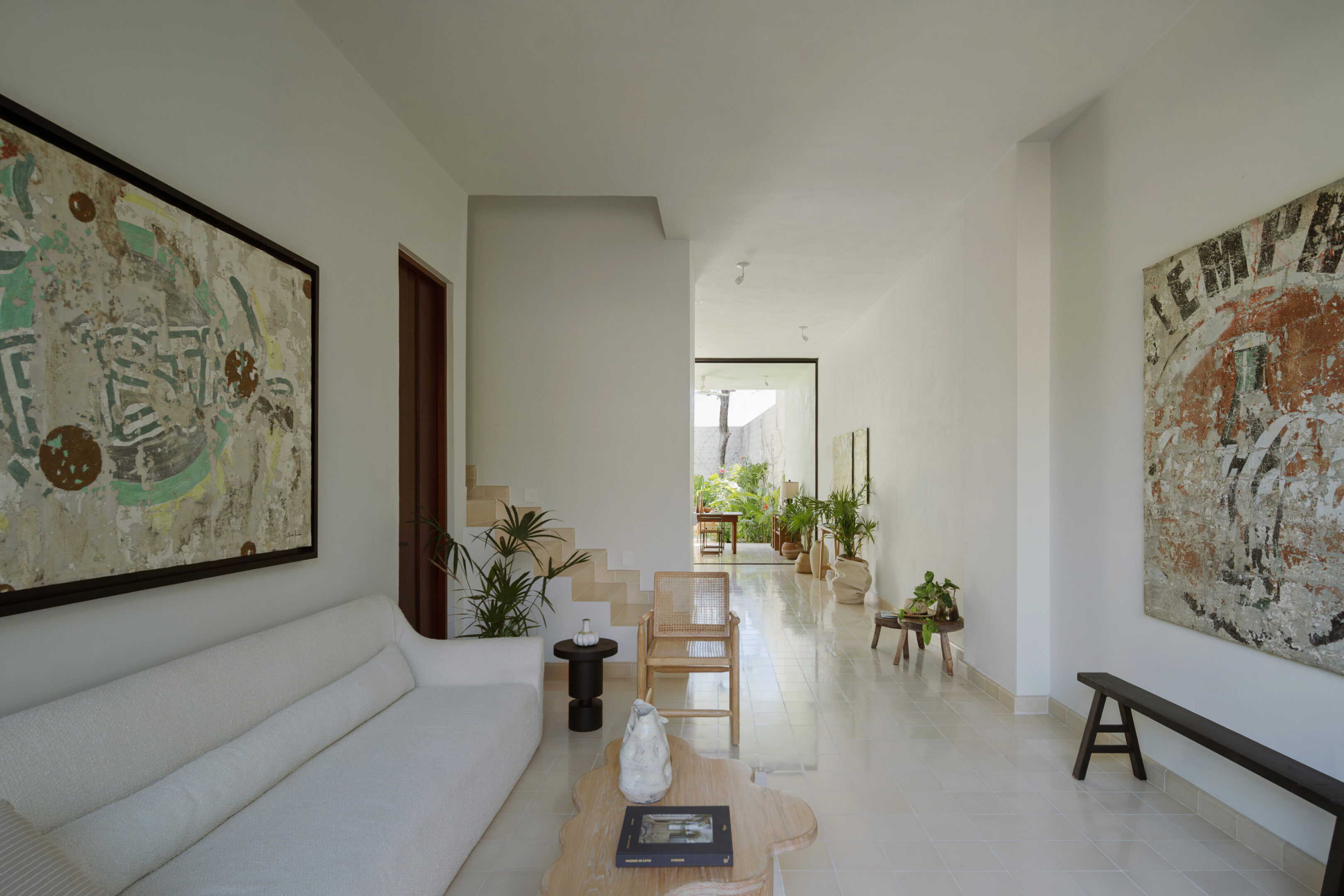 Bright minimalist living room with artwork and plants