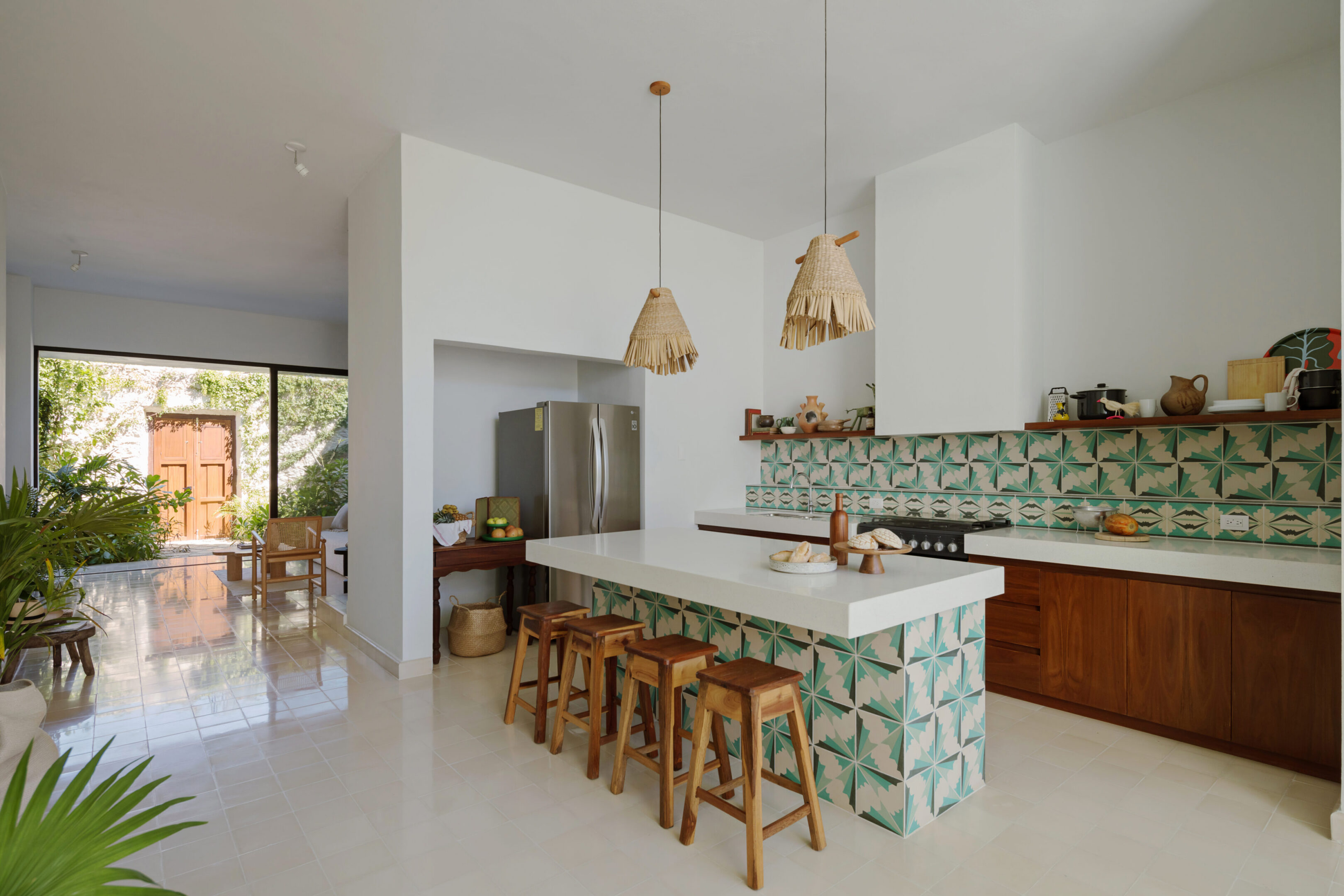 Modern kitchen island with green patterned tiles