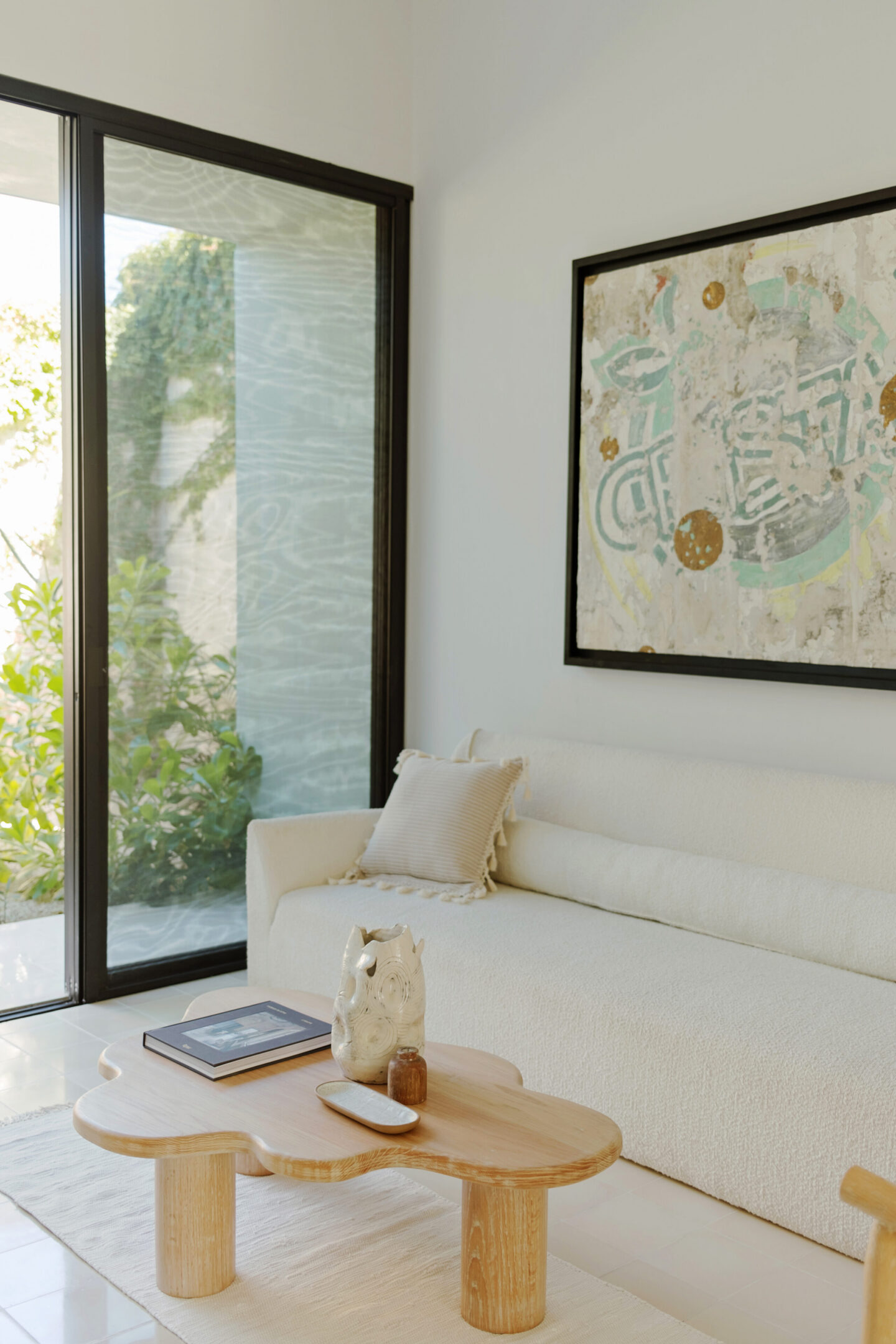 Minimalist living room with white sofa, coffee table