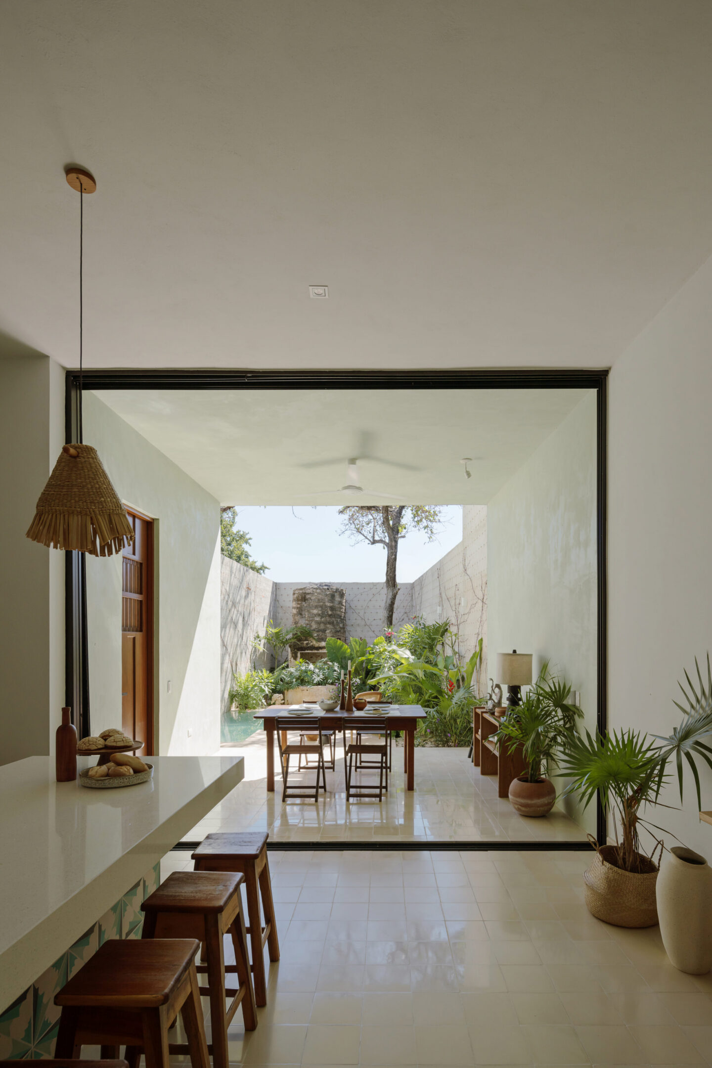 Open-plan kitchen and dining with courtyard