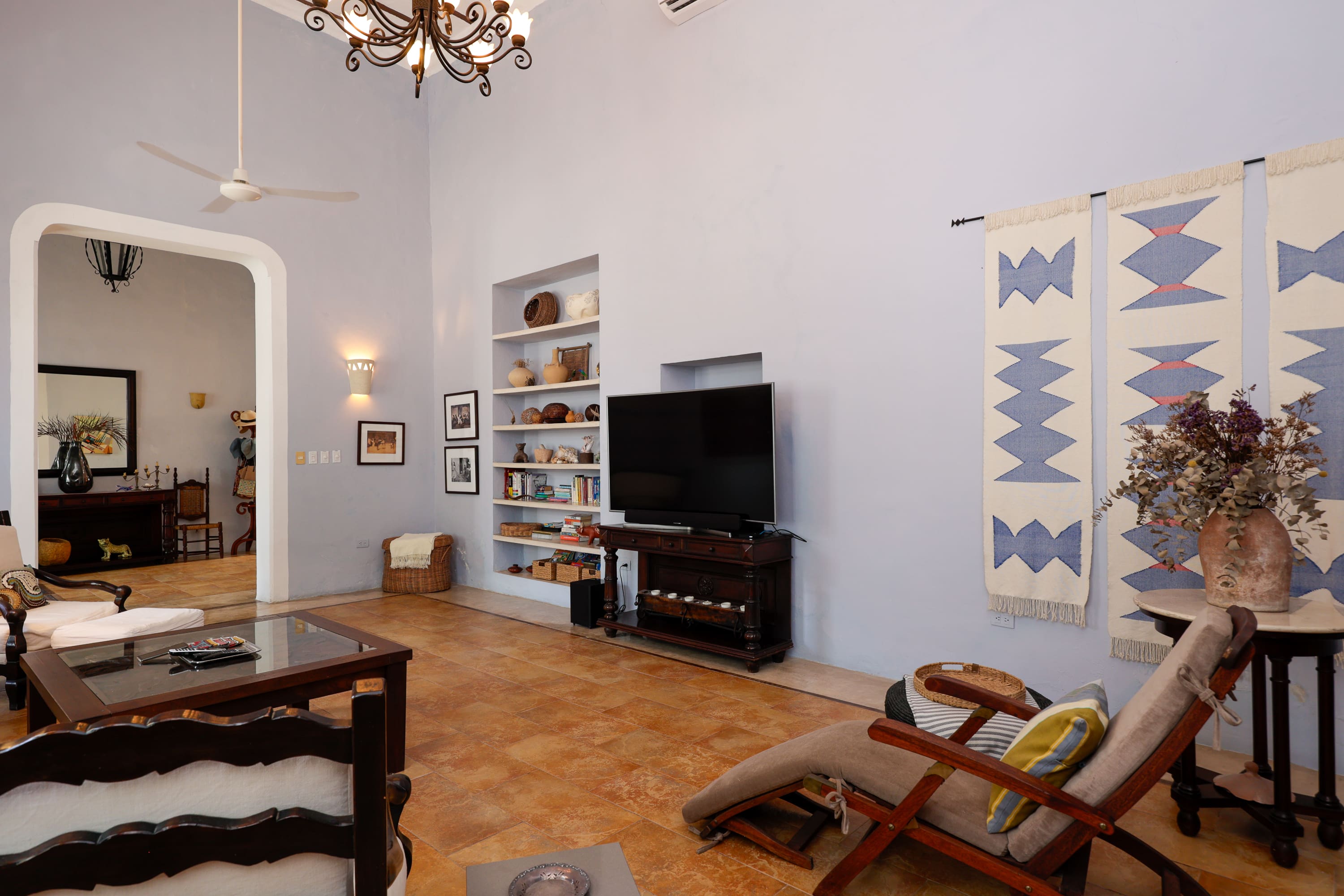 Cozy living room with TV and tapestries