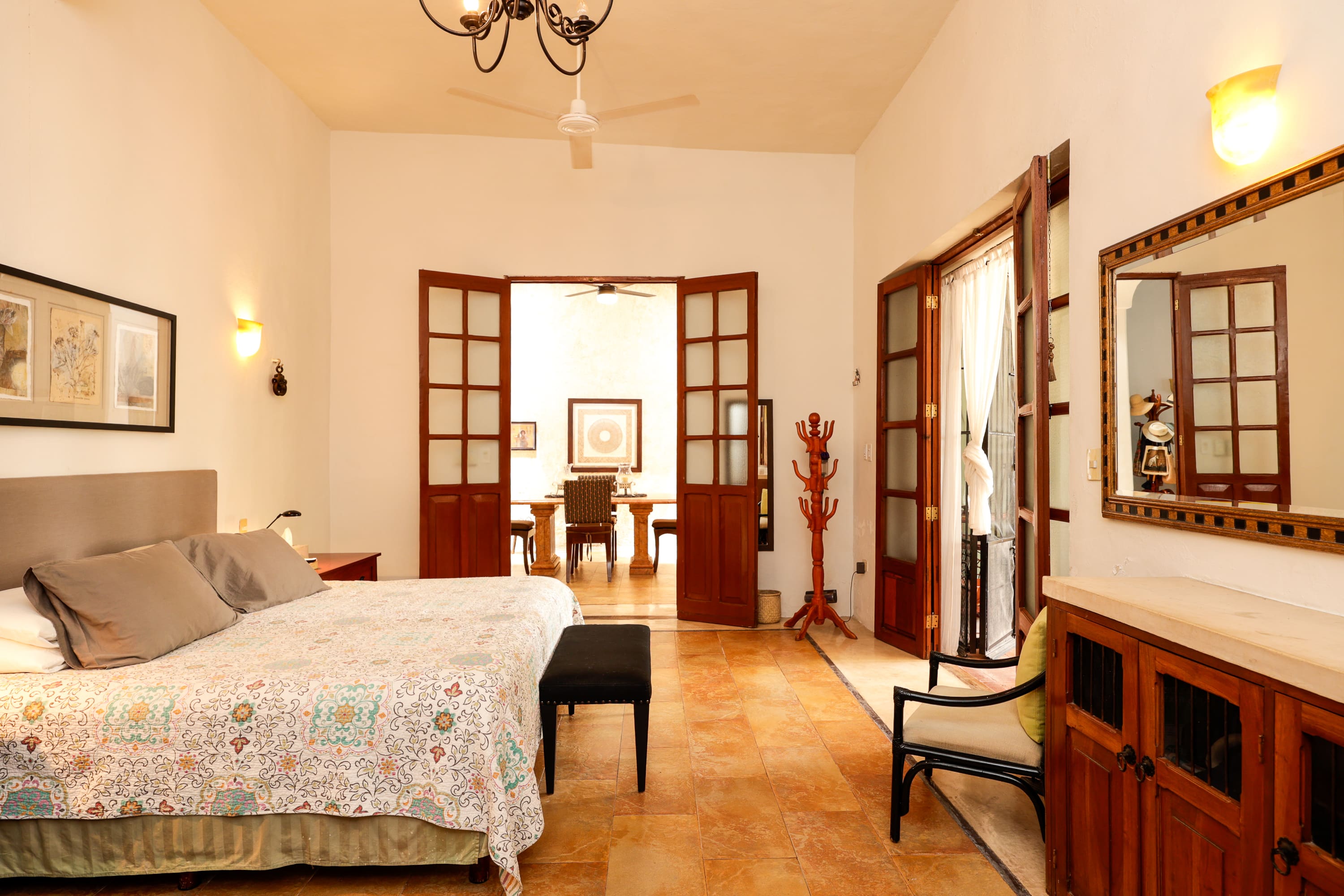 Spacious bedroom with open French doors