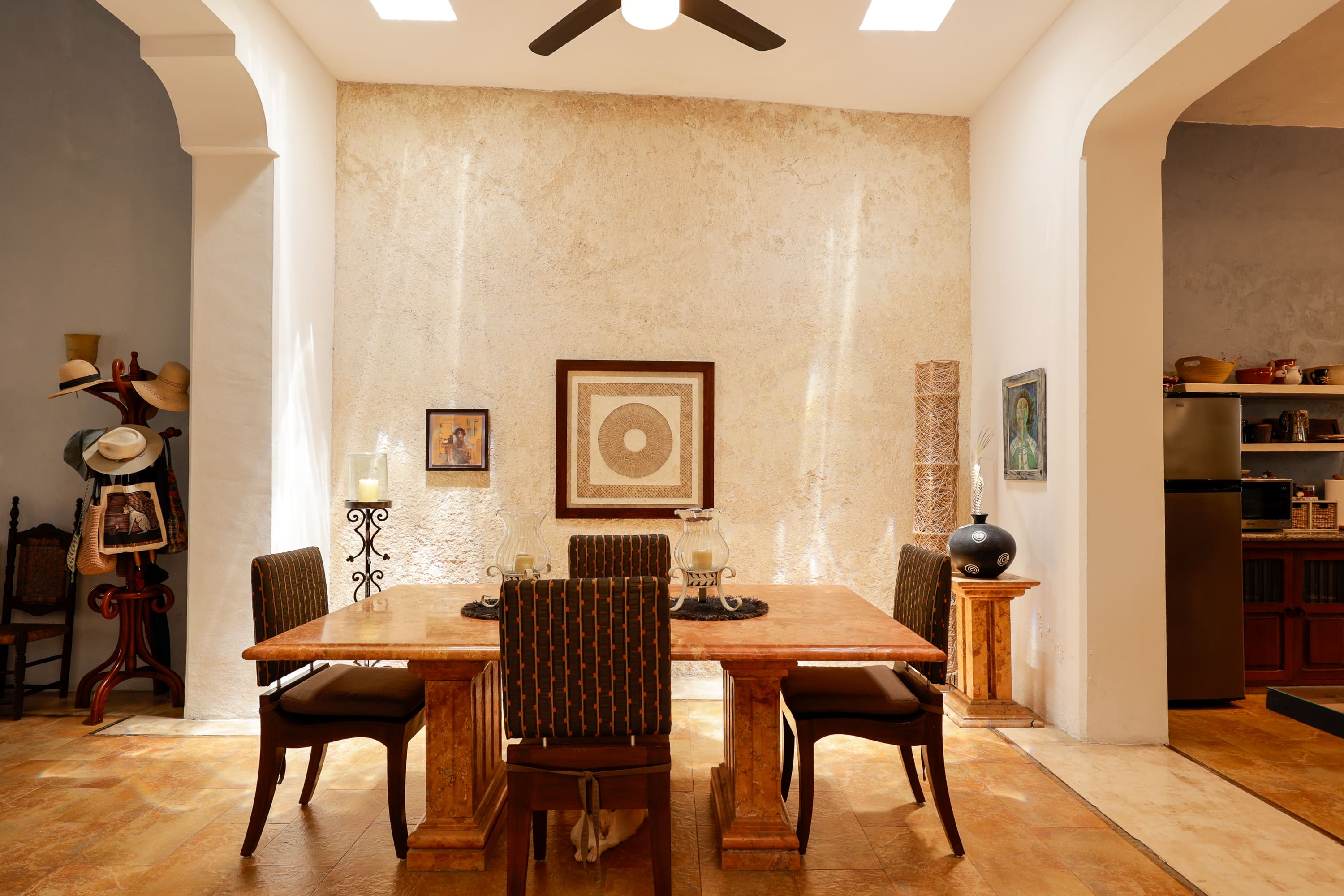 Sunlit dining room with wooden table