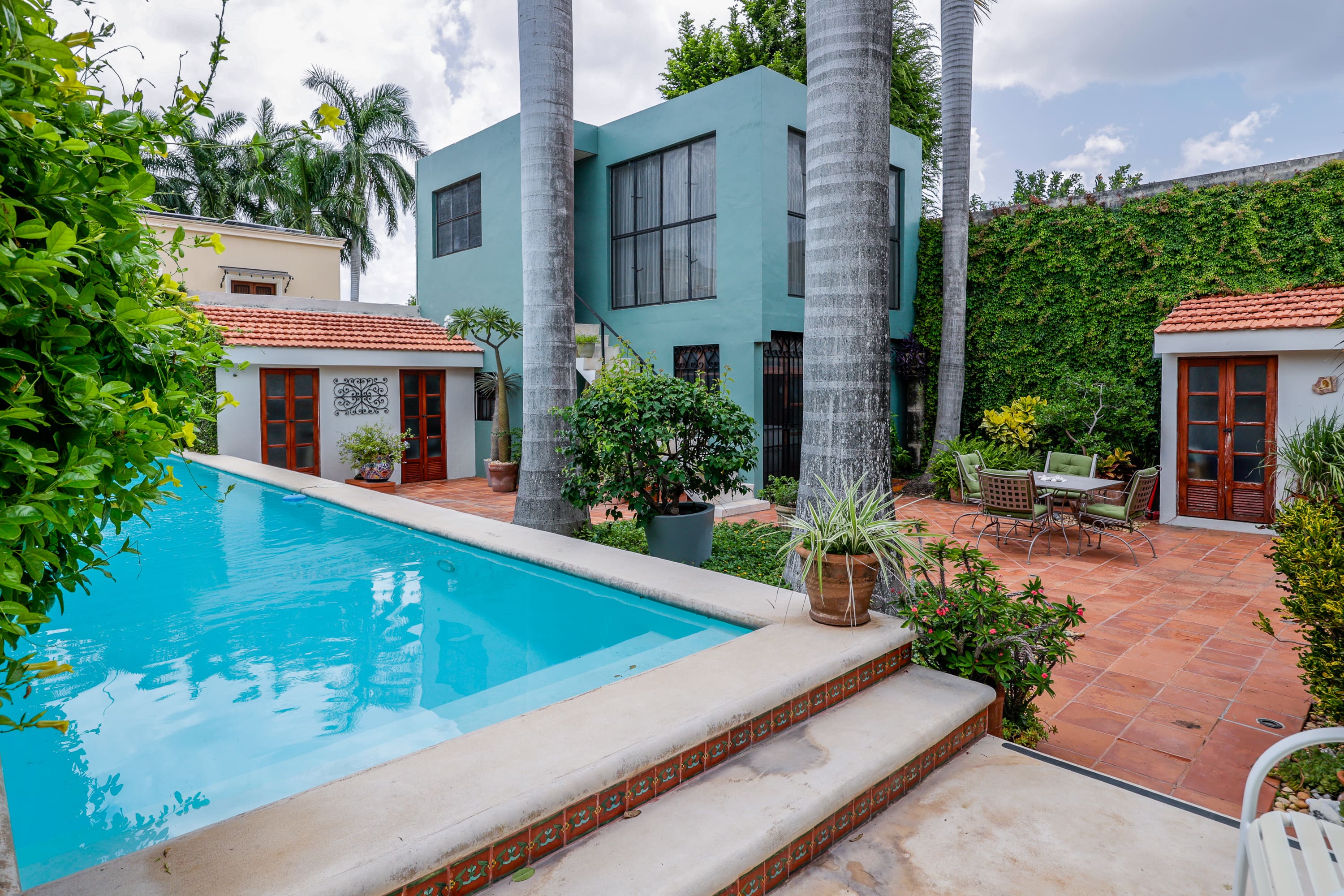 Tropical courtyard with swimming pool and patio