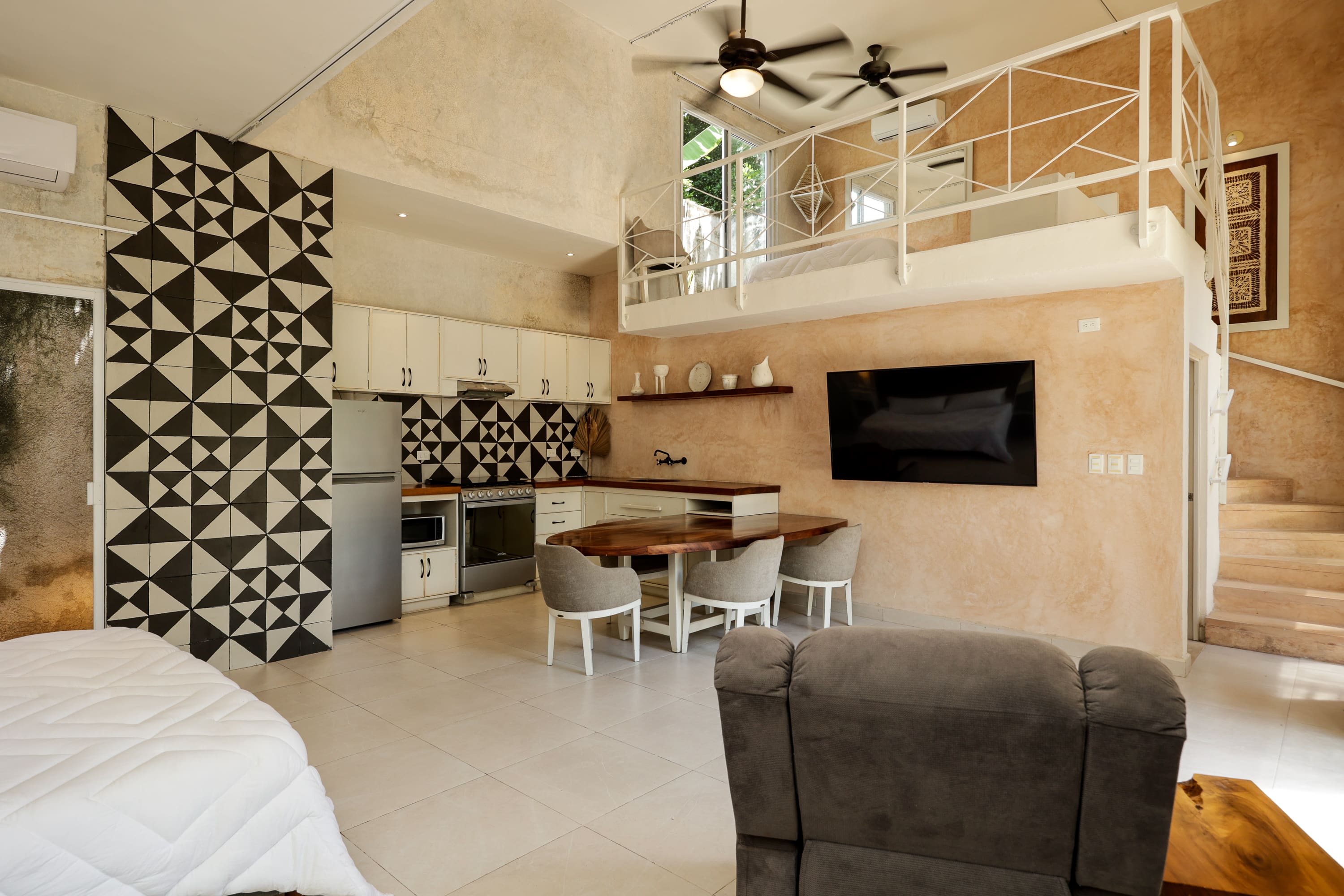 Modern loft apartment interior with kitchenette